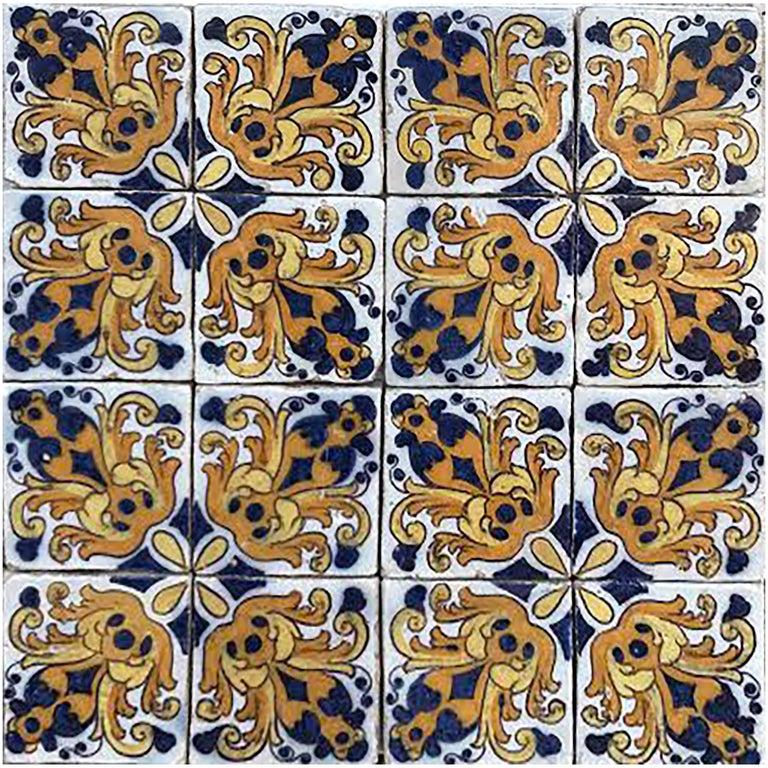 17th century Portuguese polychrome blue and yellow on white pattern mural.

Painted with Majolica style.
Majolica is the beautiful ware prepared by tin-glazing earthenware and firing it a second time. After the first firing, the bisque is dipped