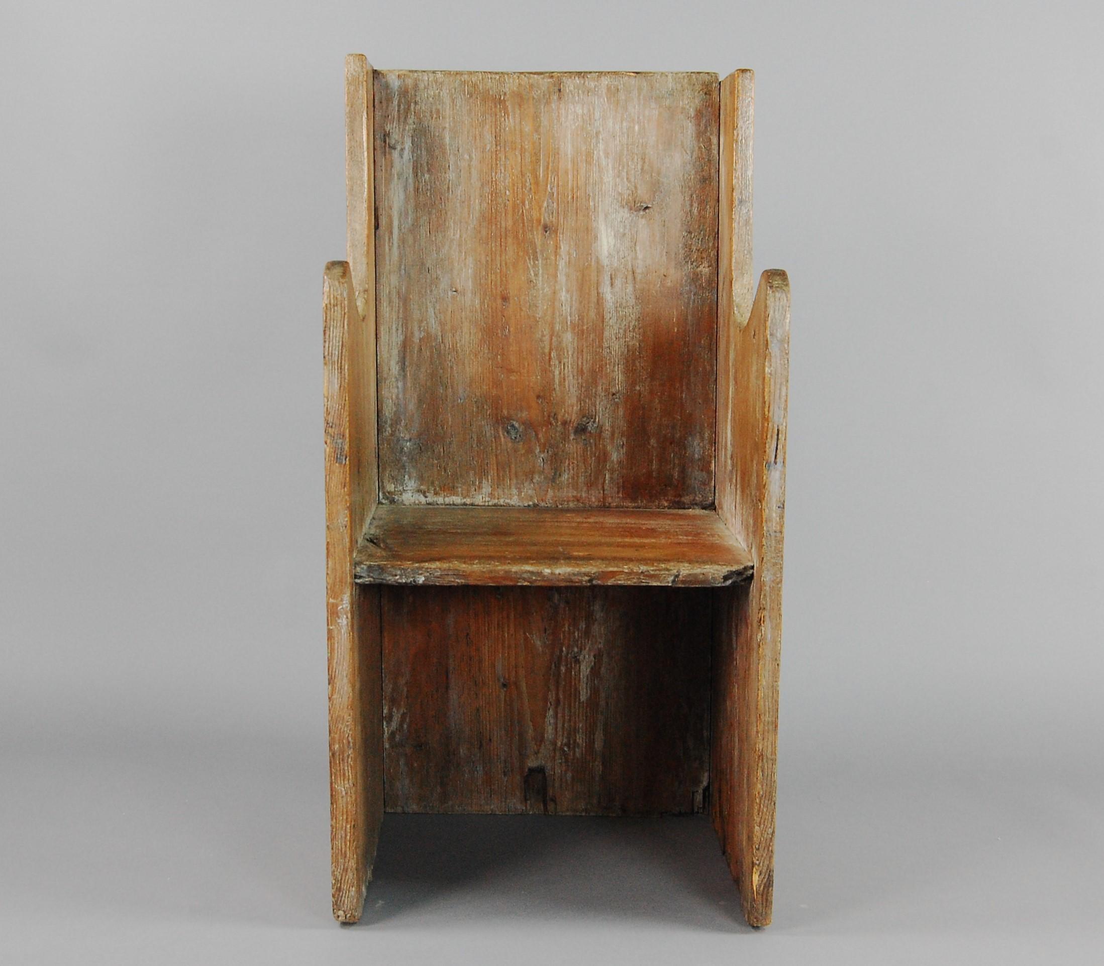 Primitive plank chair or settle. Dating to the late 17th century, wonderful untouched patina. Originating from Grande Chartreuse (1084) the head monastery of the Carthusian religious order founded by St Bruno located North of Grenoble, France, this