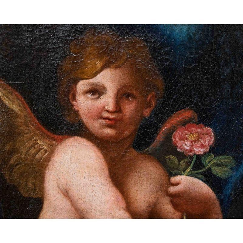 Italian 17th Century Putto with Rose Painting Oil on Canvas Emilian School For Sale