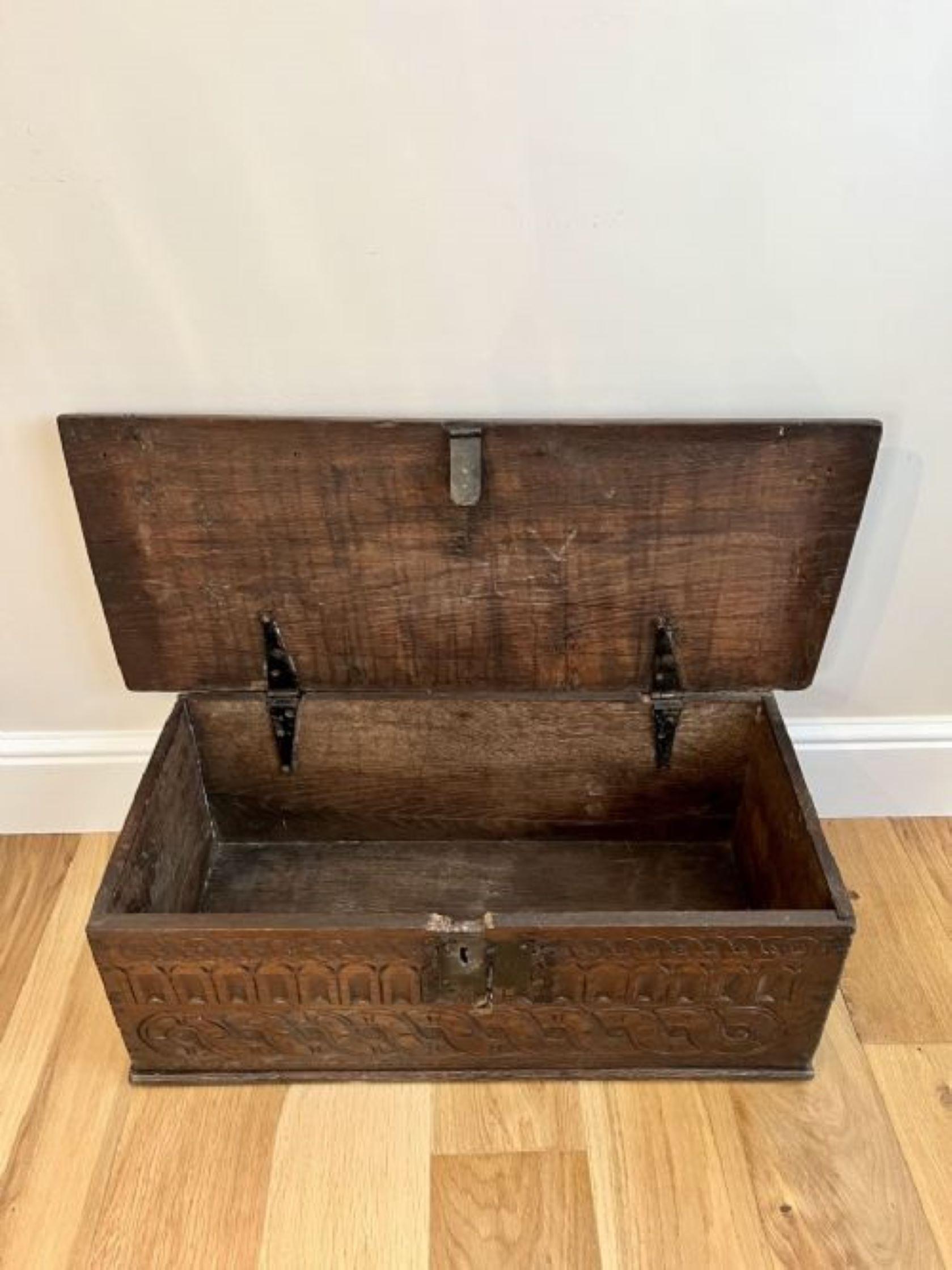 17th century quality oak bible box having a quality oak bible box with original carved decoration to the front with an iron lock plate working key and lock, lift up top opening to reveal a storage compartment 