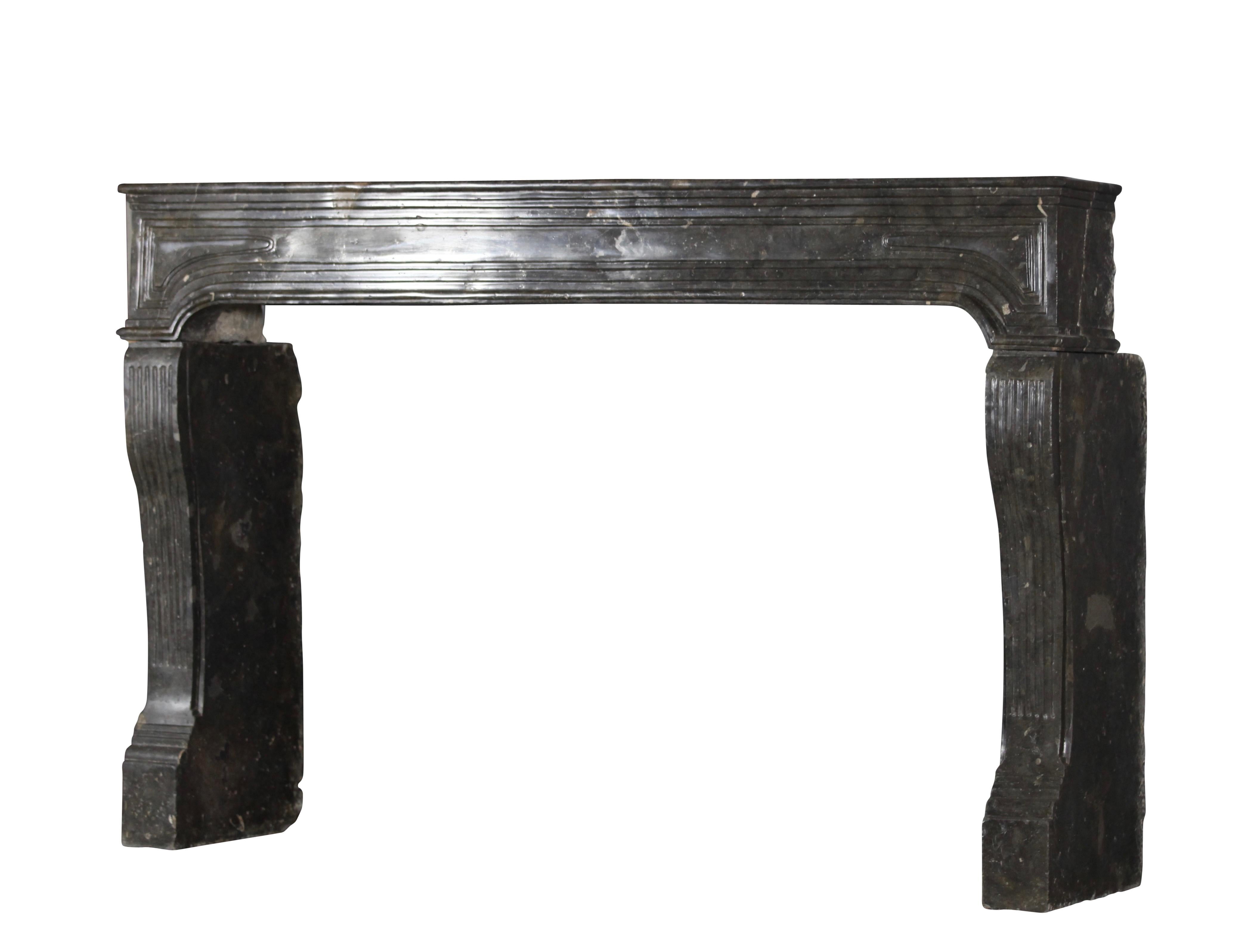 This original Italian antique fireplace surround in fossil stone is one of a kind. Unique proportions. See the images for the details of the carving. A real museum piece that works both in classic contemporary interiors with high end modern period