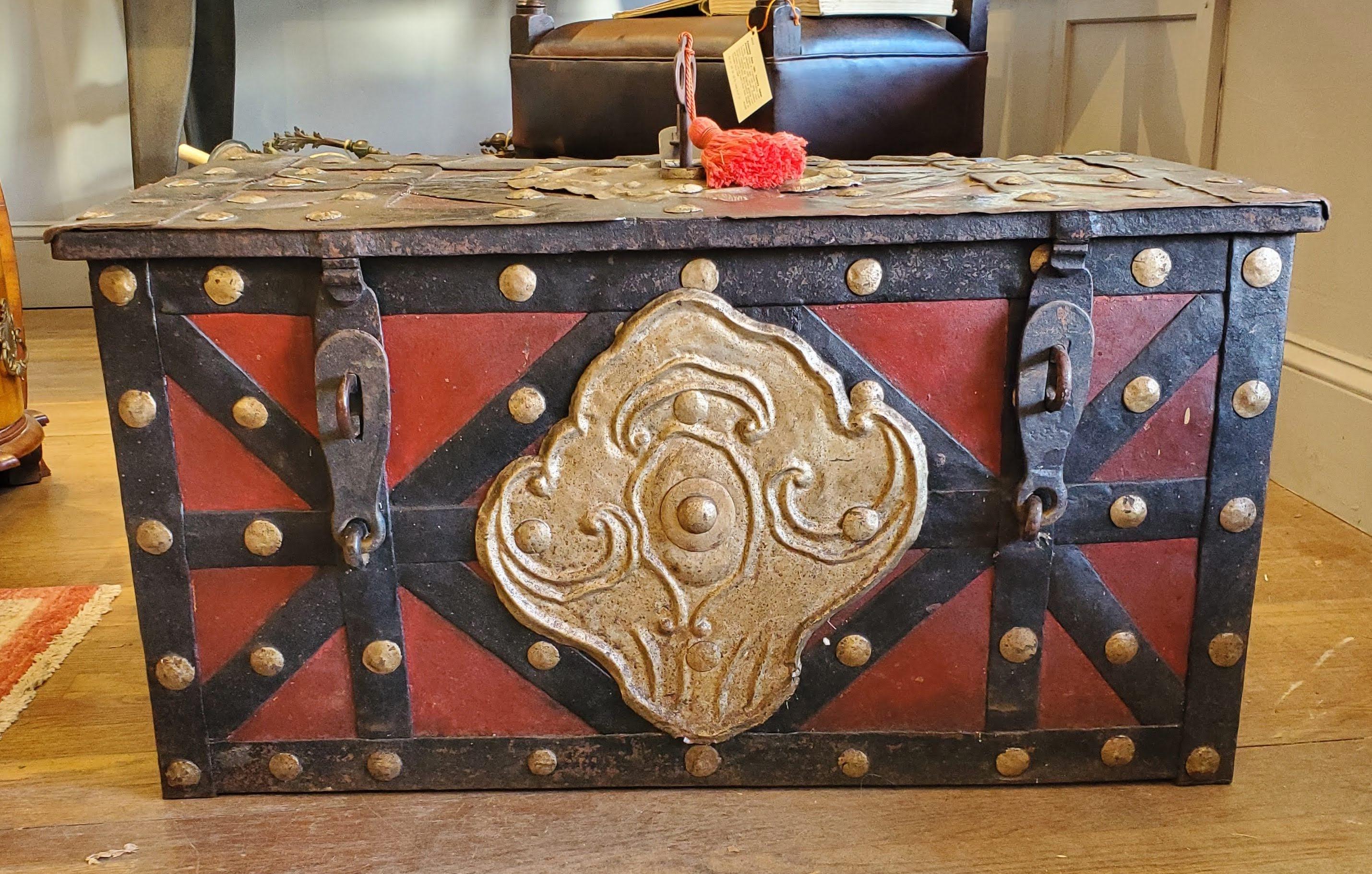 17th century Spanish “Armada” style iron strong box or treasure chest. This piece will make a terrific addition to your interior design project and you will have so much fun showing it off. The extraordinarily complicated mechanism clicks with such