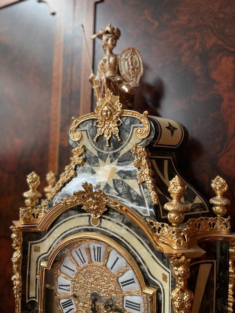 A clock and console table in the style of Louis XIV made by parisian cabinet maker Lessure who specilised in the reproduction of statues of horses. He was famous throughout the courts of Europe for his art. 

Size clock: 60x25x106h
Size console