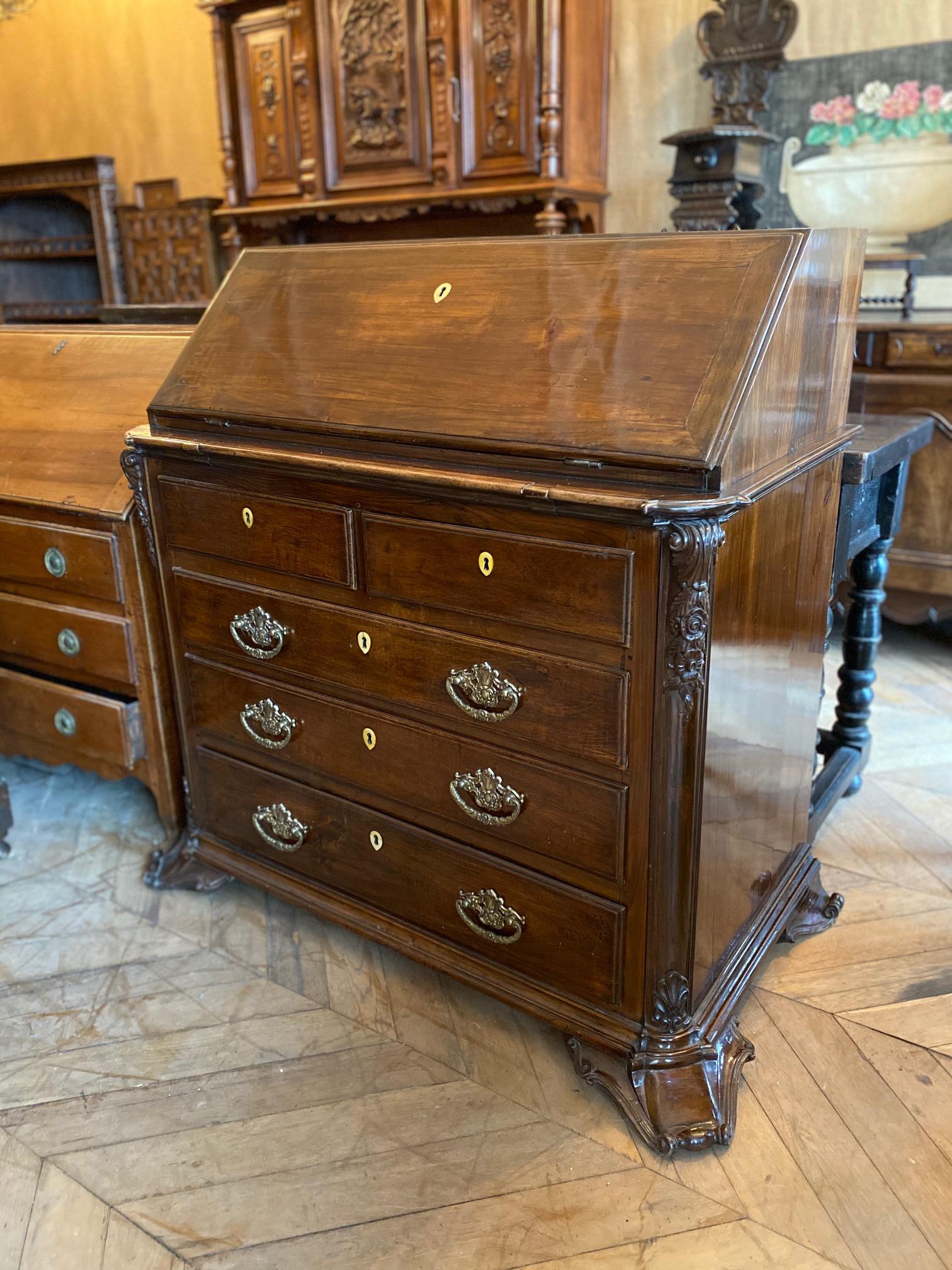 This stunning rosewood secretaire features many drawers, storage spaces, and intricate carvings decorate the exterior. A beautiful piece that serves both functional and aesthetic purposes.

Measurements: 47