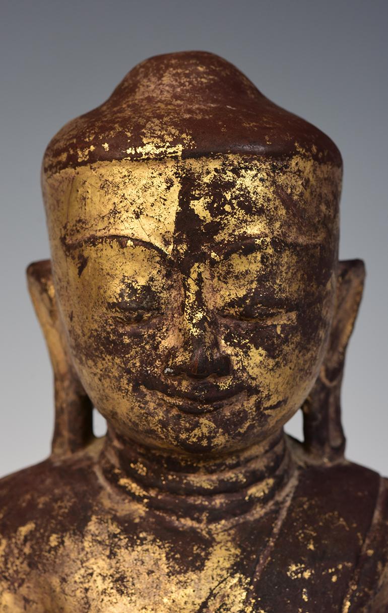 Burmese wooden Buddha sitting in Mara Vijaya (calling the earth to witness) posture on a base.

Age: Burma, Shan Period, 17th Century
Size: Height 33 C.M. / Width 19 C.M.
Condition: Nice condition overall (some expected degradation due to its