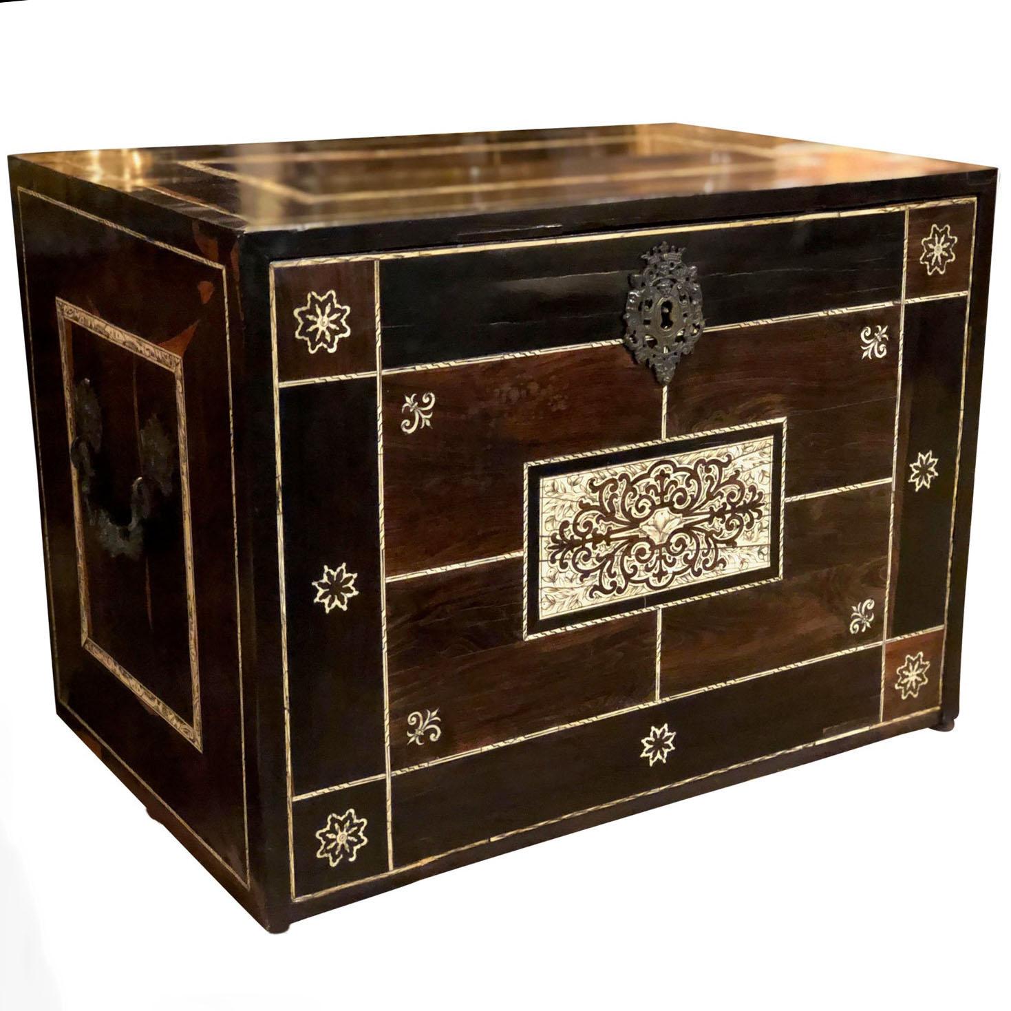 A 17th century silver mounted Coromandel wood with mother of pearl inlay traveling box with a Interior fitted with drawers and a reliquary cabinet. With key.