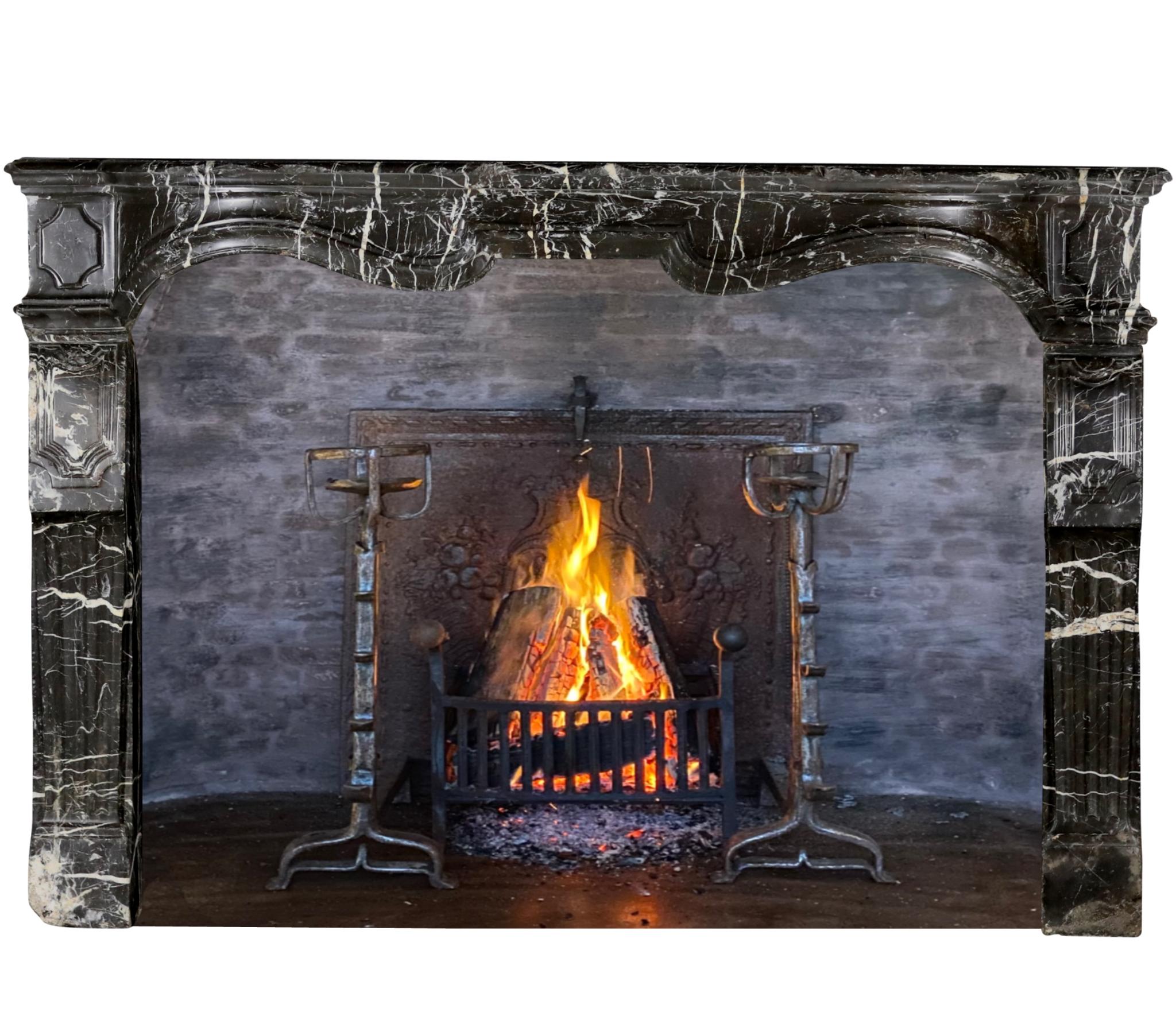 French 17th Century Small Fireplace Mantel In Dark Marble With White Veining For Sale