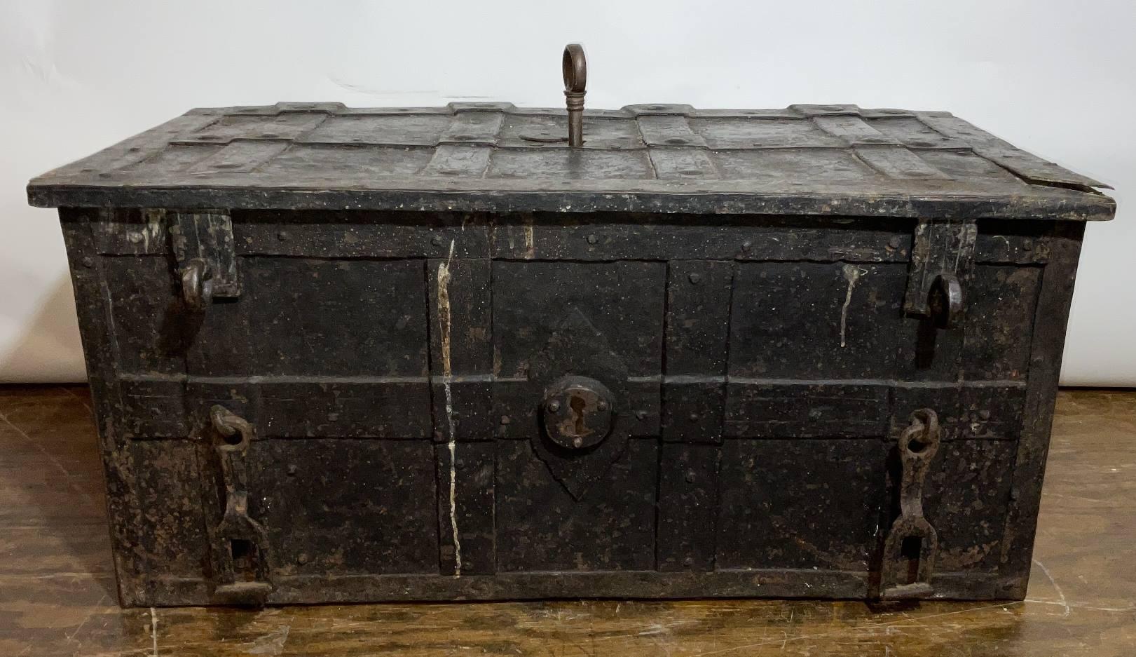 17th Century Iron Strong Box from the Spanish Armada. Extremely heavy. This is an iron bound strong box for storing valuables in the 16th and 17th centuries. This great old maritime relic has a large complicated lock on the underside of the lid.