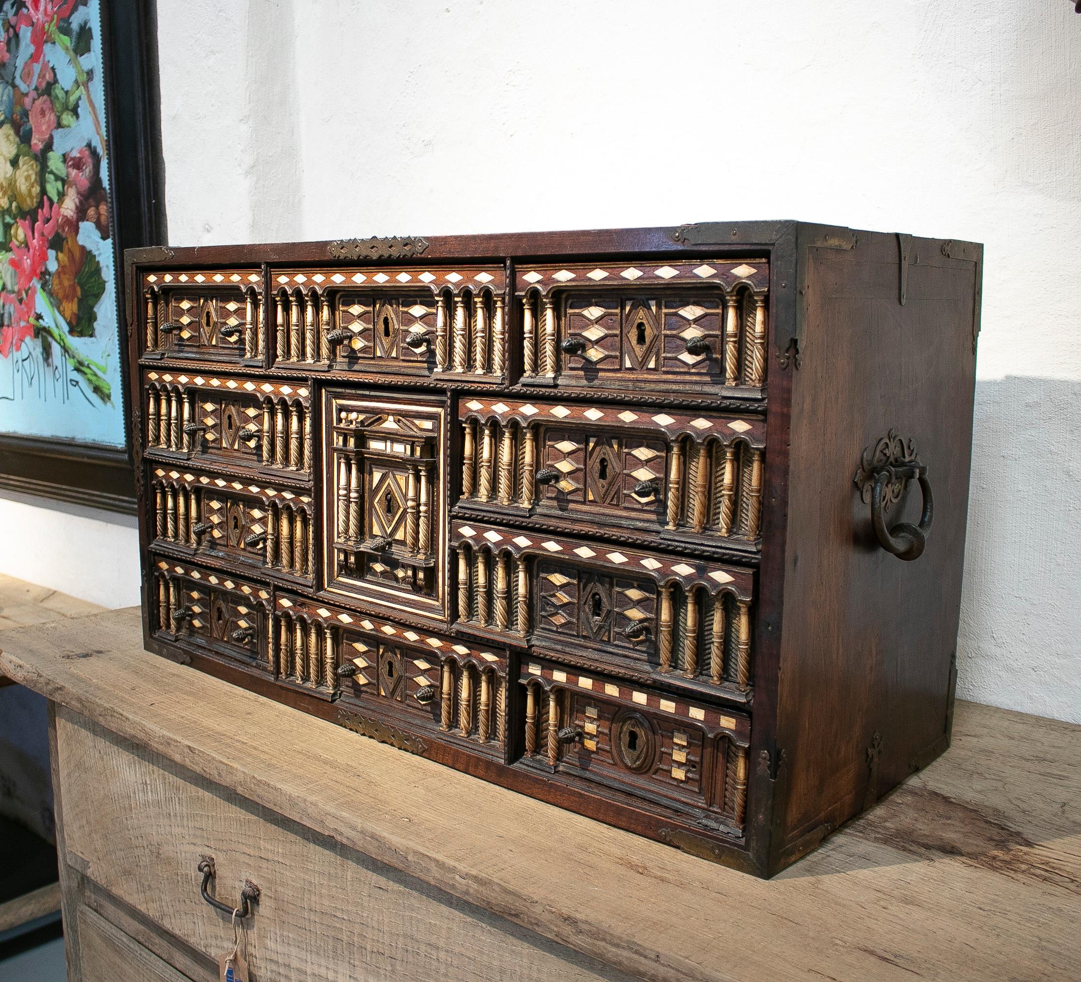 Antique 17th century Spanish bargueño desk hand made 10-drawer and 1-door wooden portable chest.


 