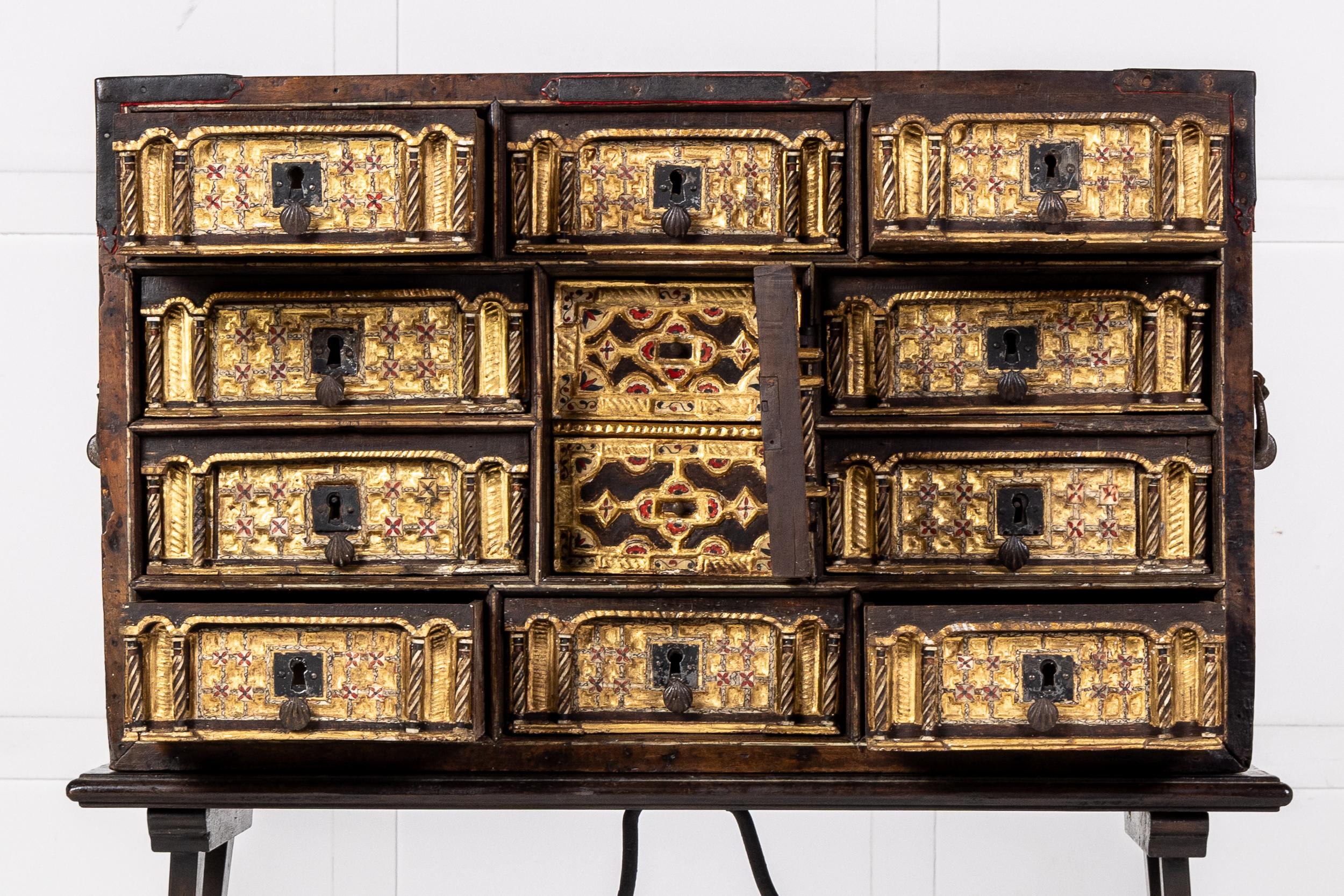 A Very Fine 17th Century Spanish Bargueño Vargas Cabinet on Later 19th Century Stand.

The Bargueño consisting of banks of drawers and a central door concealing two more small drawers. This style of cabinet was a speciality in Spain with examples