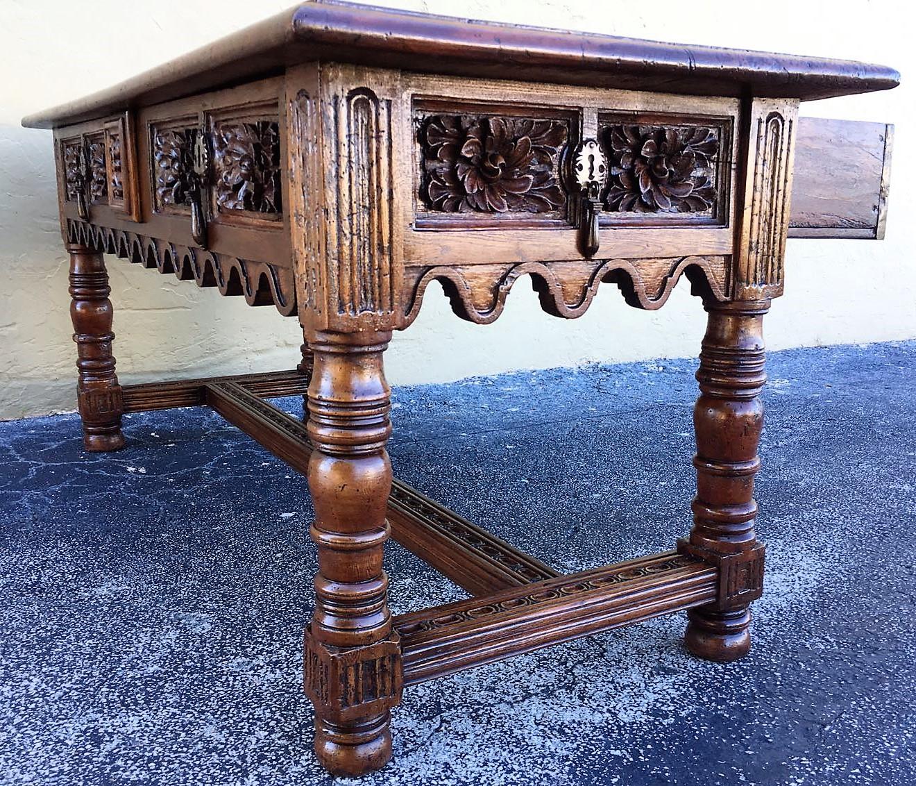 17th century Spanish Baroque carved walnut, refectory console table

A Spanish Baroque walnut table. The rectangular top above two frieze drawers, over ring turned legs, joined by stretchers to the sides and one central stretcher on bun