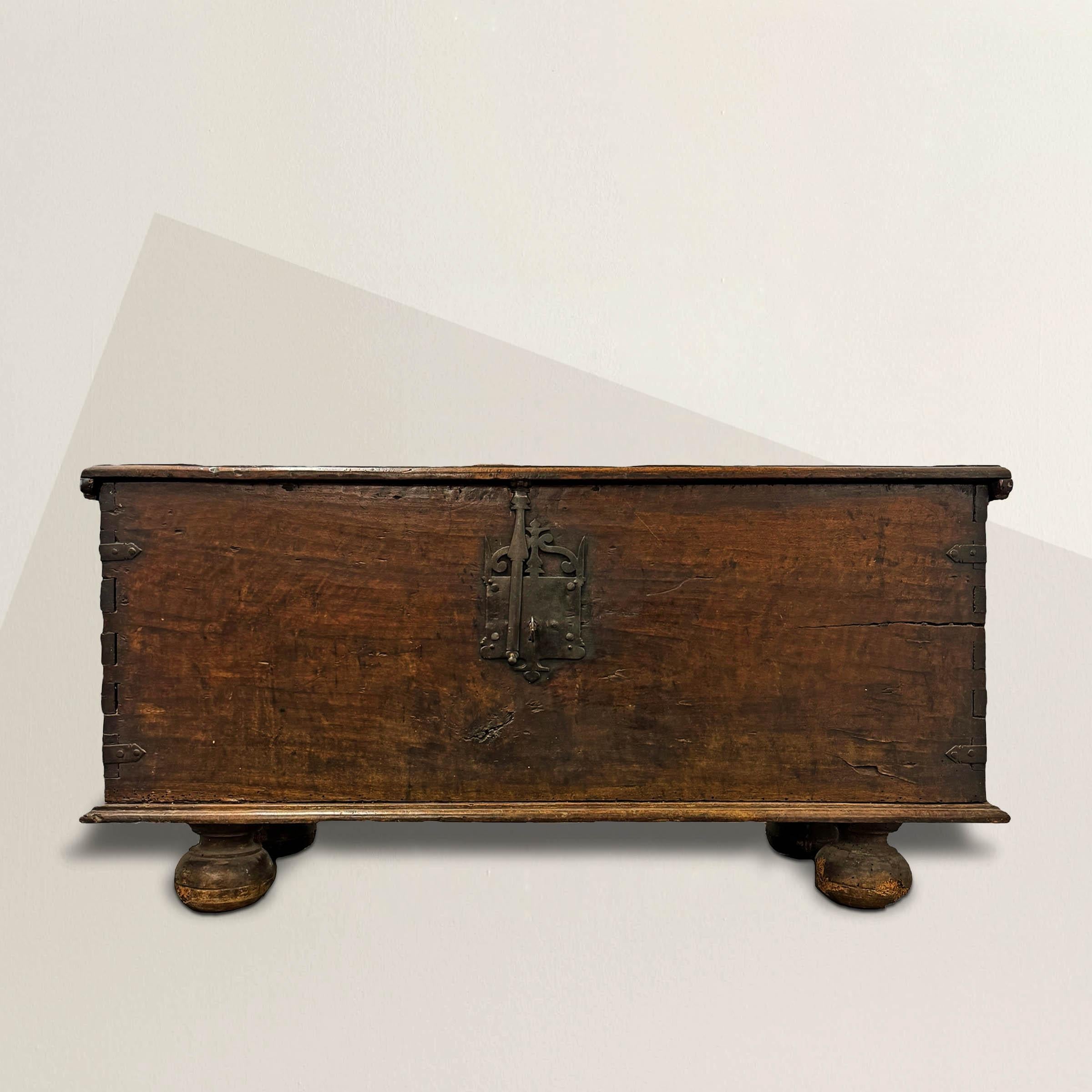 This 17th-century Spanish trunk epitomizes the grandeur and opulence of the Spanish Baroque period, showcasing unparalleled craftsmanship and timeless elegance. Constructed from solid one-inch thick planks, a testament to the craftsmanship of