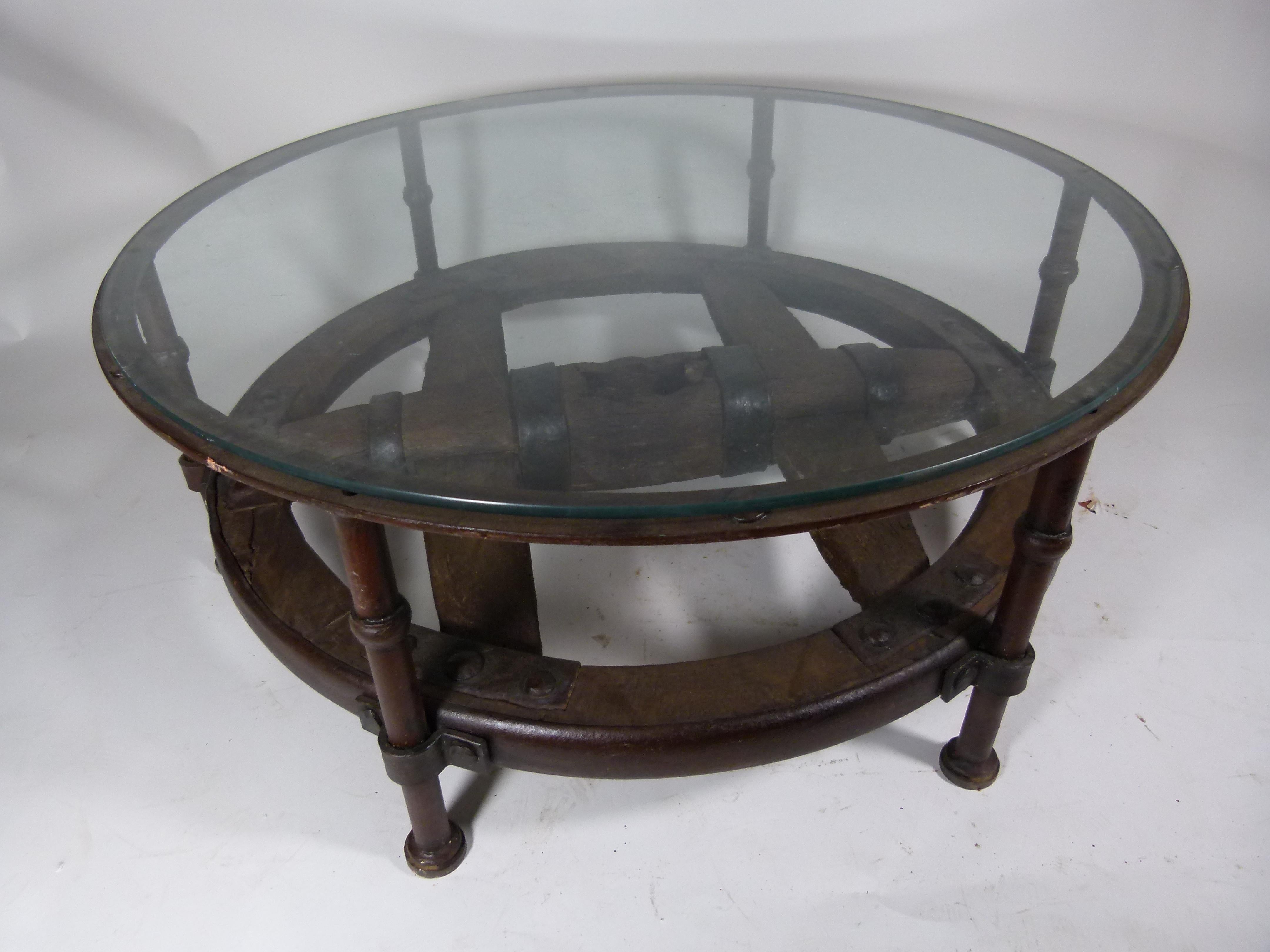 This wonderful side table consist of an antique Spanish 17th century cart-wheel which was named: 