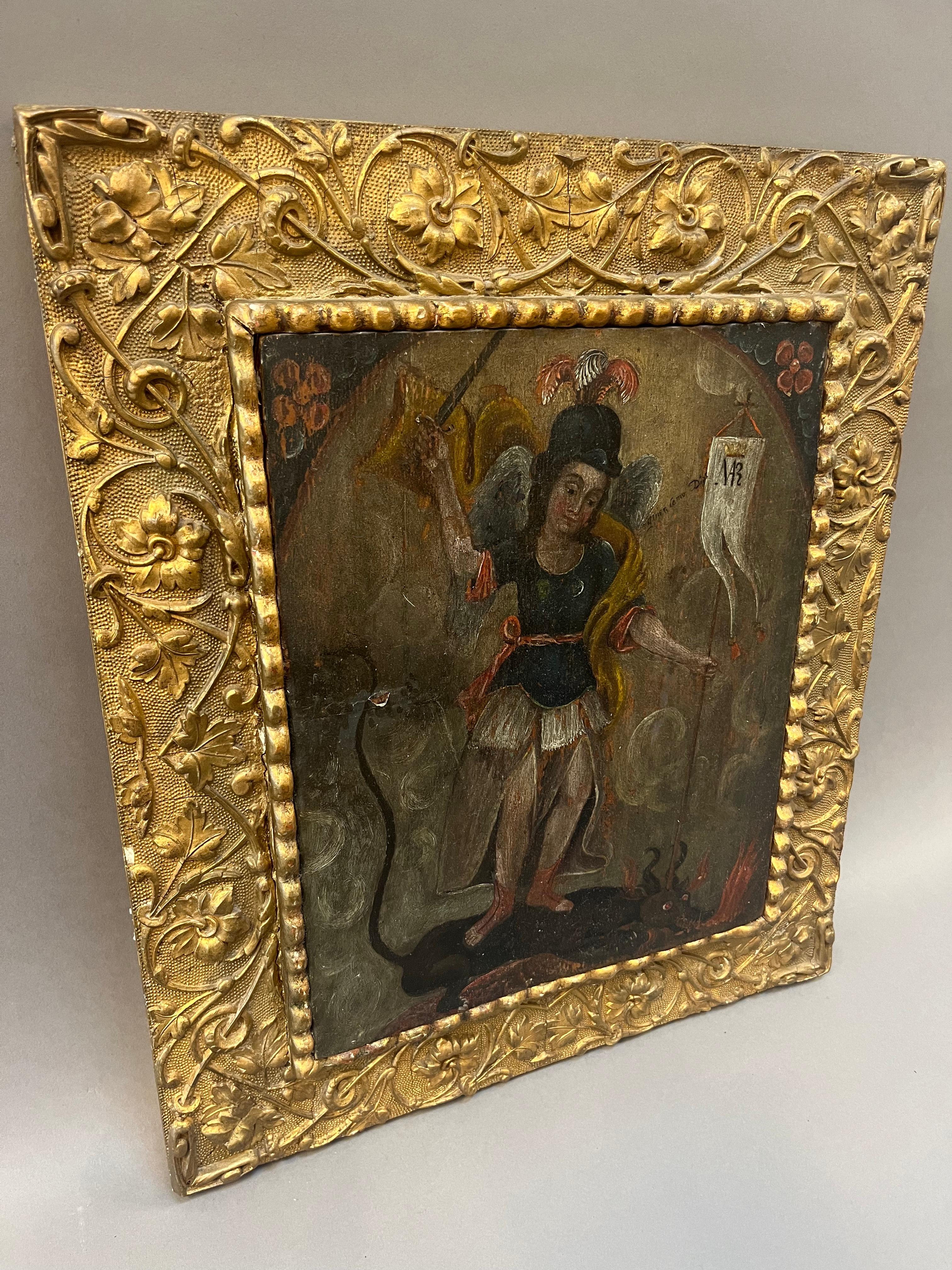 17th century Spanish Colonial Peruvian painting. Cusco school, oil on wooden panel depicting “Saint George and the Dragon” with intricate 19th Century carved and gilt frame. Cusco Peru Circa 1650.
