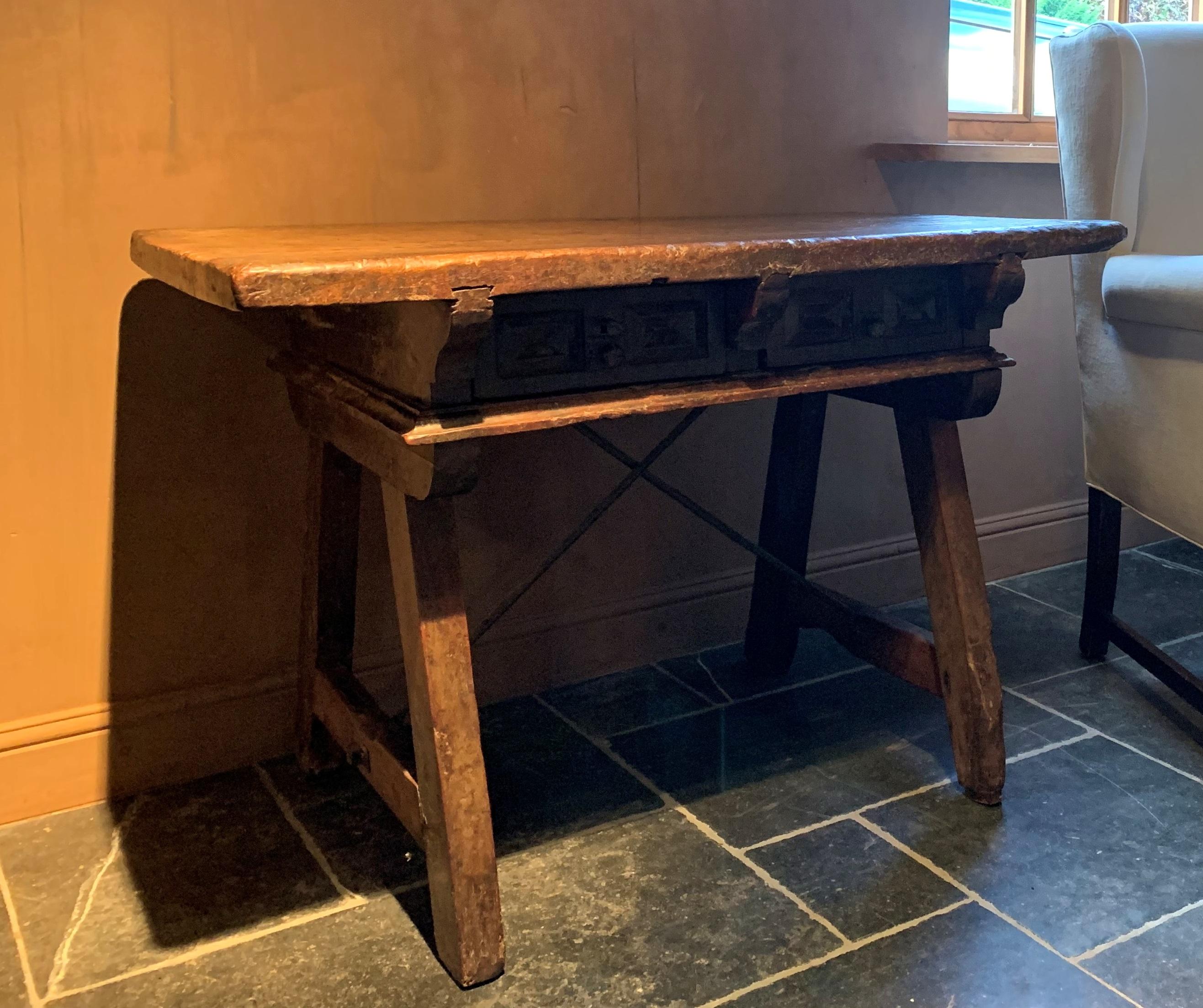 A fine 17th century Spanish walnut trestle table. Sometimes referred to as rent or balliu table these kinds of small sidetables were often used to exchange financial affaires. As they had a prominent function these were well made and finished. This