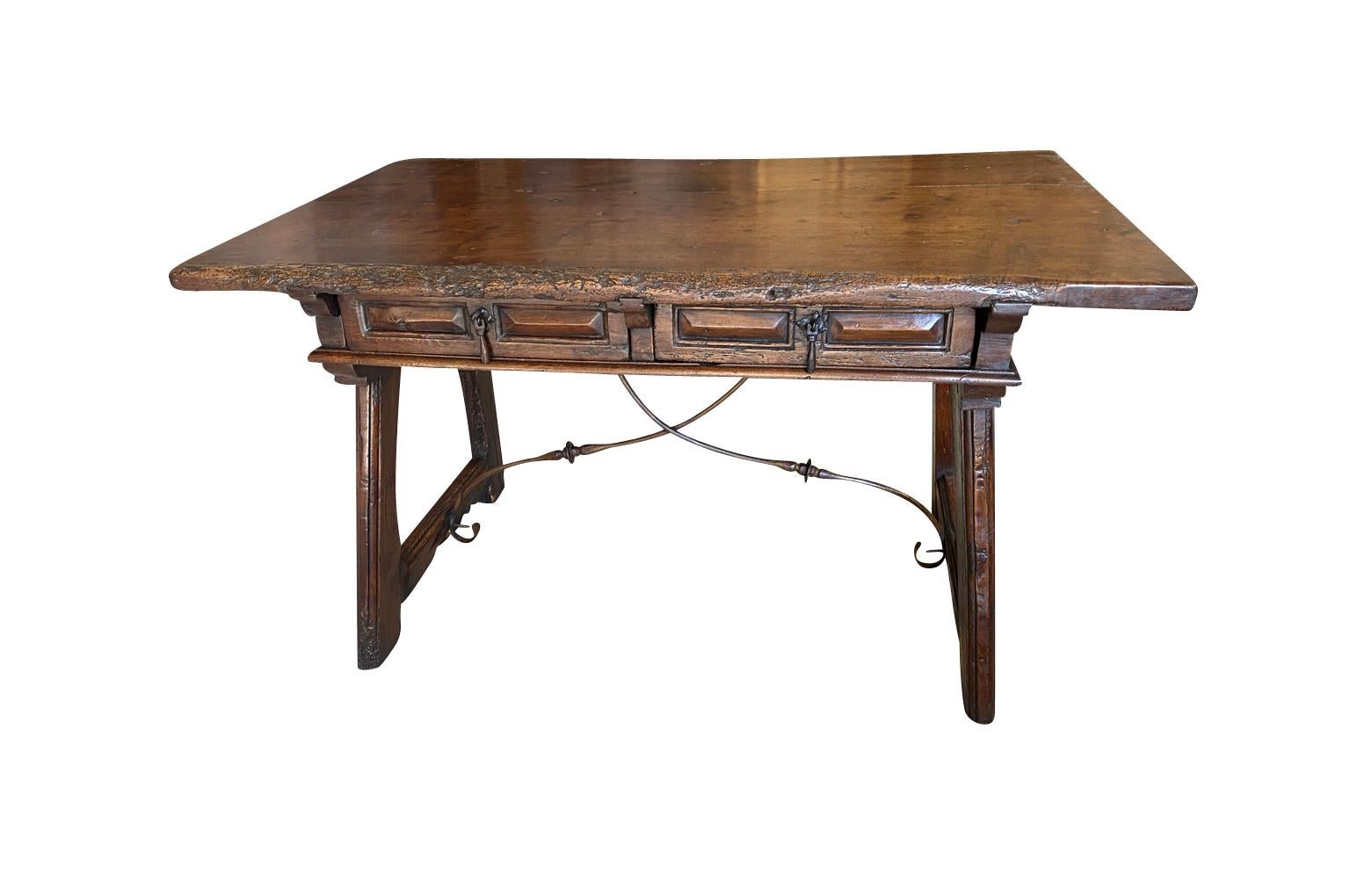 An outstanding and very handsome 17th century Spanish Writing Table - Desk from the Catalan region of Spain.  Beautifully constructed from stunning walnut & chestnut with drawers, a solid walnut board top and hand forged iron stretchers.  Sumptuous
