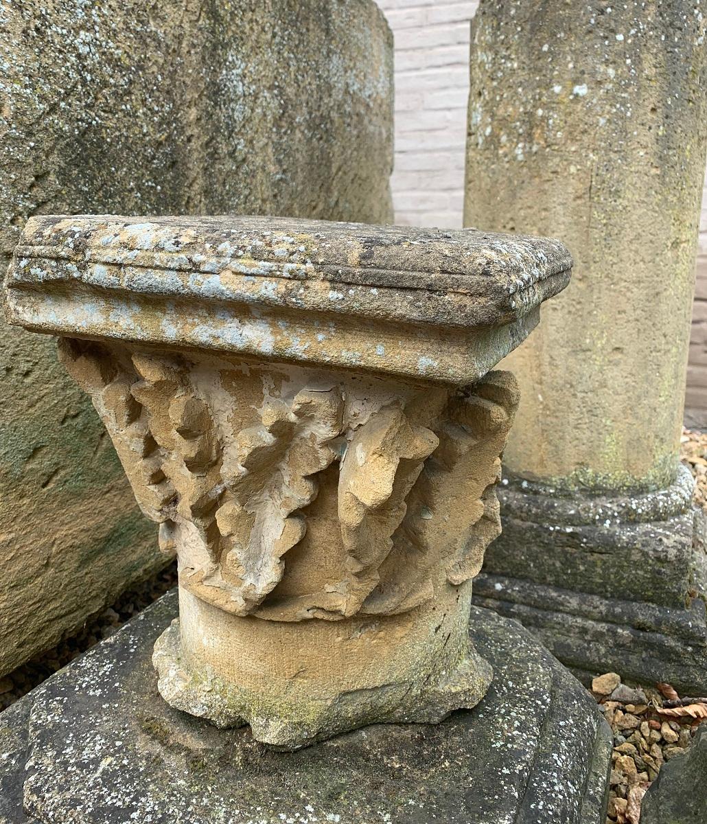 A large 17th century French capital on a associated base. Sculpted front and sides, flat backside. Great to decorate a garden or display indoors.