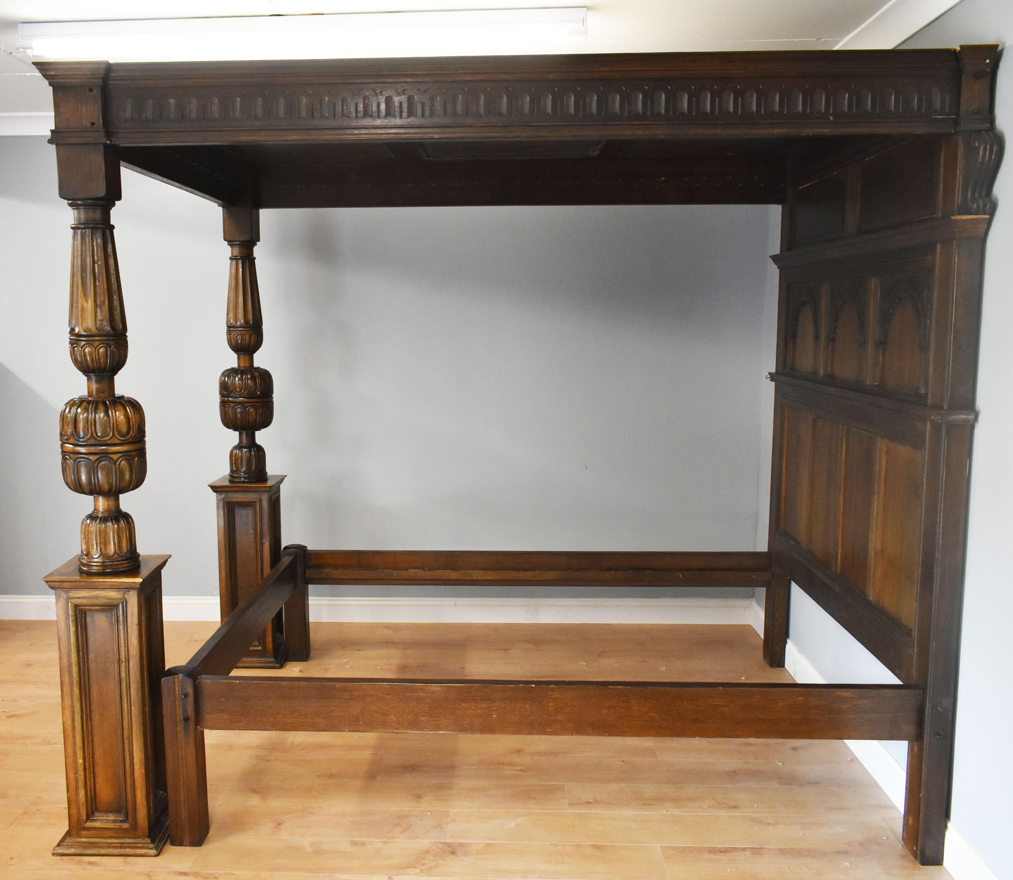 For sale is a superb quality Elizabethan style carved oak four-poster bed. The paneled canopy above a carved headboard with arched panels over plain square panels, joining the bed frame. The canopy is supported by two opposing gadrooned bulbous