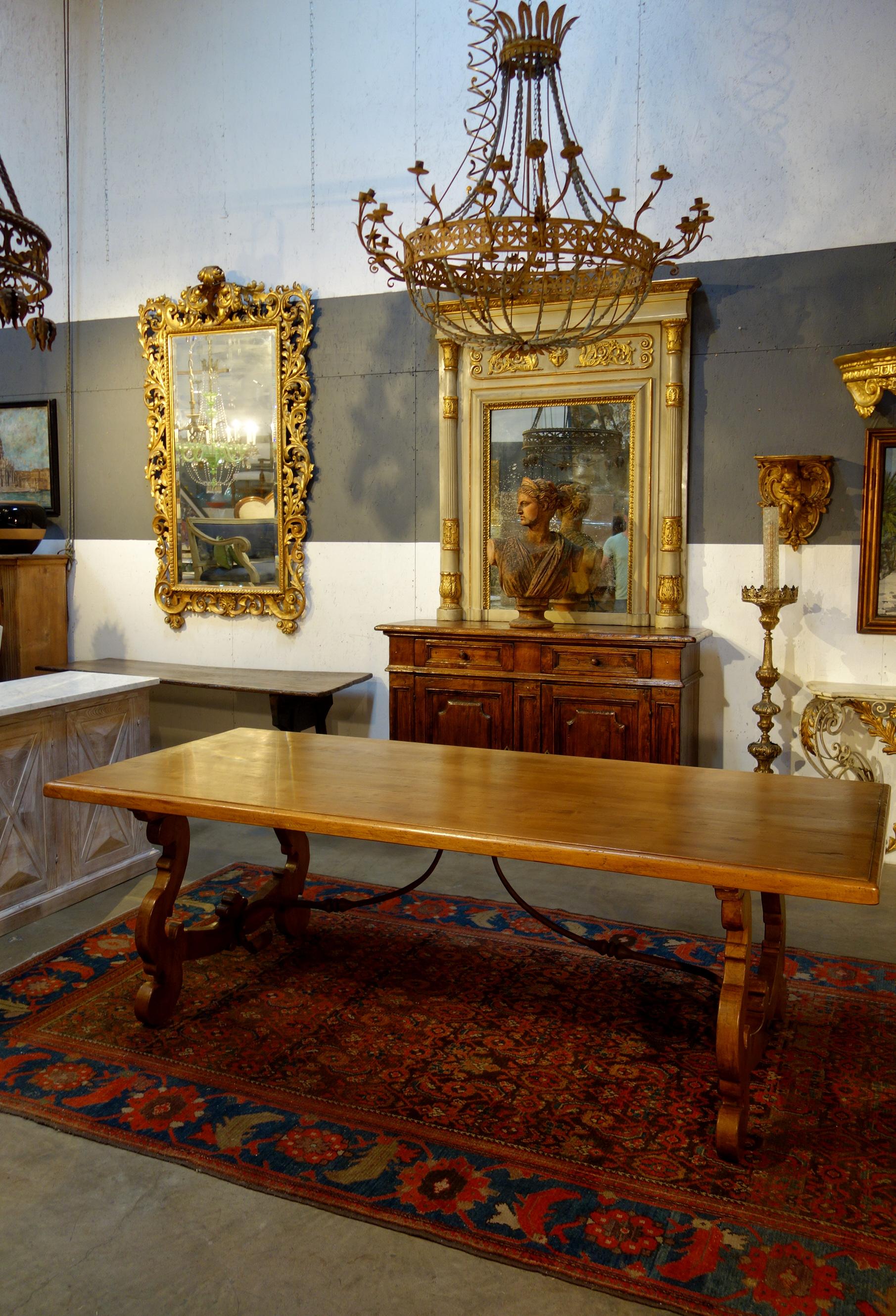 Our classic 17th Century style Lira refectory Old Walnut dining table with our new Natural finish.  Edge framed full length solid planks, lyre-shaped bases, handcrafted in aged premium Italian walnut, shown in Natural light stained shellac finish