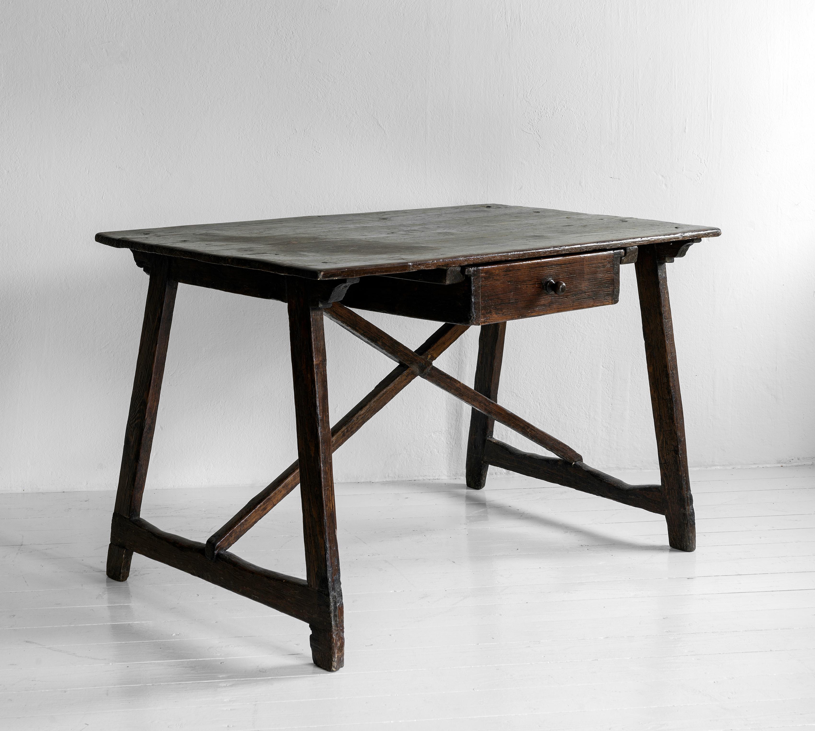 A charming beautiful slightly lower desk possibly having been used as a writing desk. Great sculptural presence, works wonderfully in a contemporary or classic interior. We are particularly fond of this design in its almost Asian simplicity 

      
