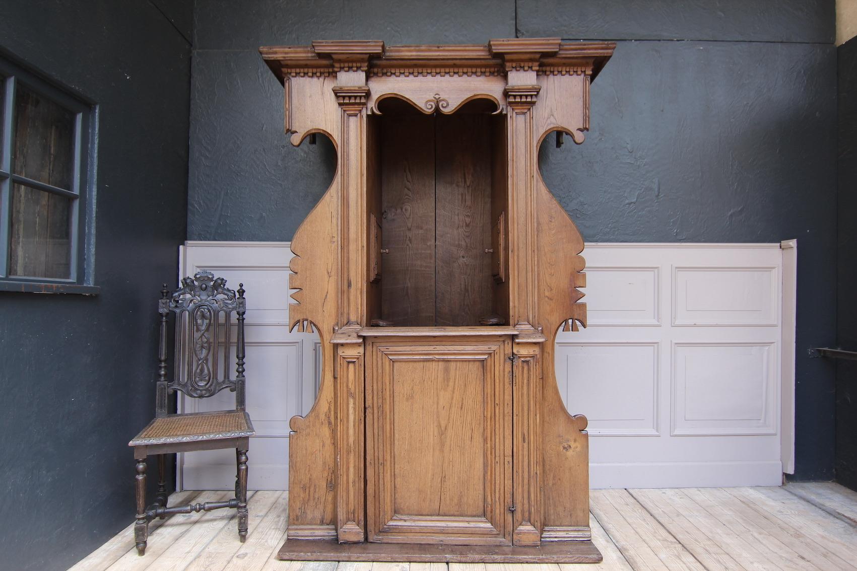 Original 17th century renaissance confessional from Vicopisano in Tuscany. Made of solid oak.

It is a confessional that can be entered from both sides. In the middle is the place for the clergyman who made the confession of the 
