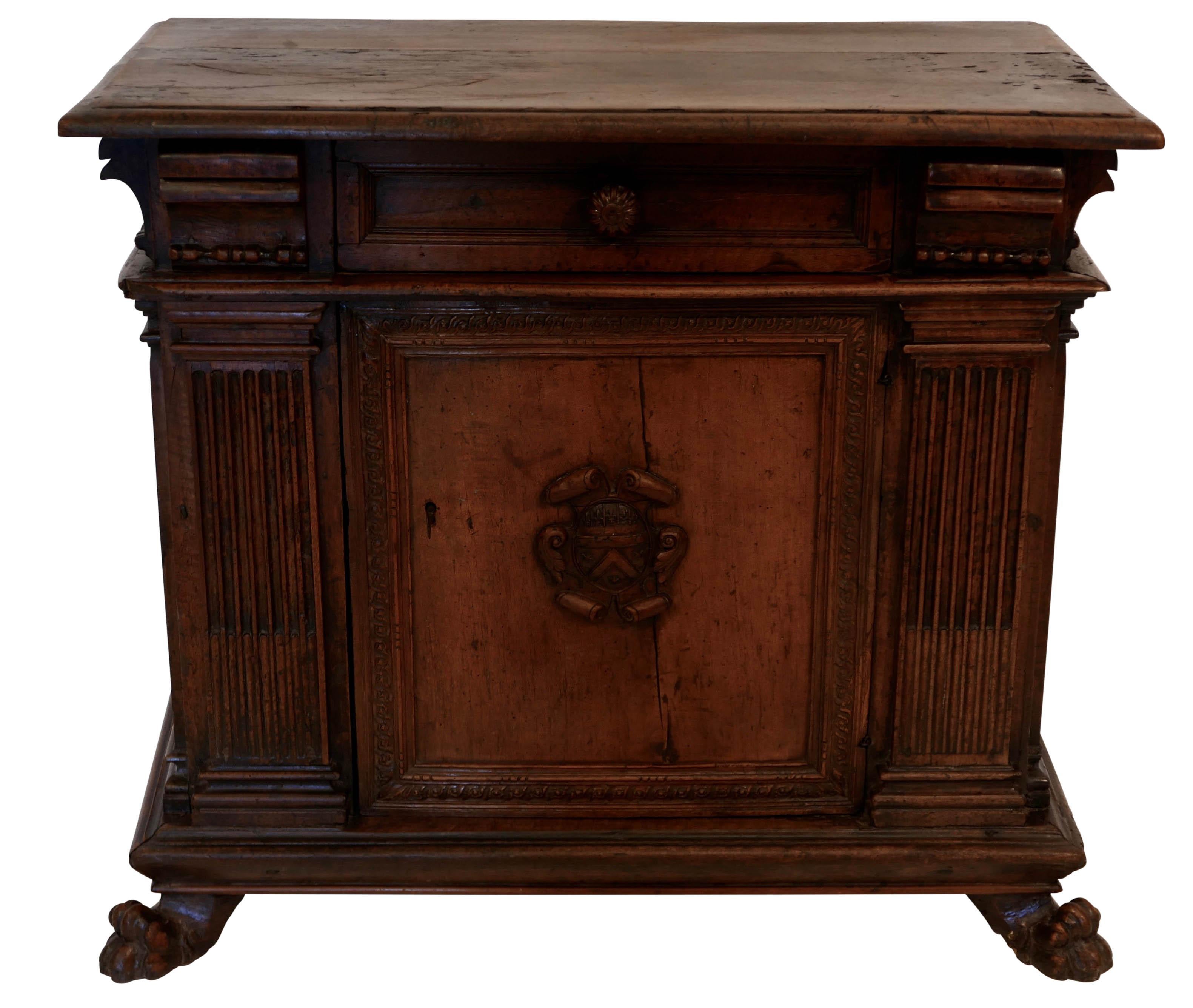Original walnut cabinet credenza with three drawers above the cabinet with stop fluted pilasters standing on four lion paw feet. The feet on this cabinet maybe older replacements.
The base has recent re-enforcements on the underside. In remarkable