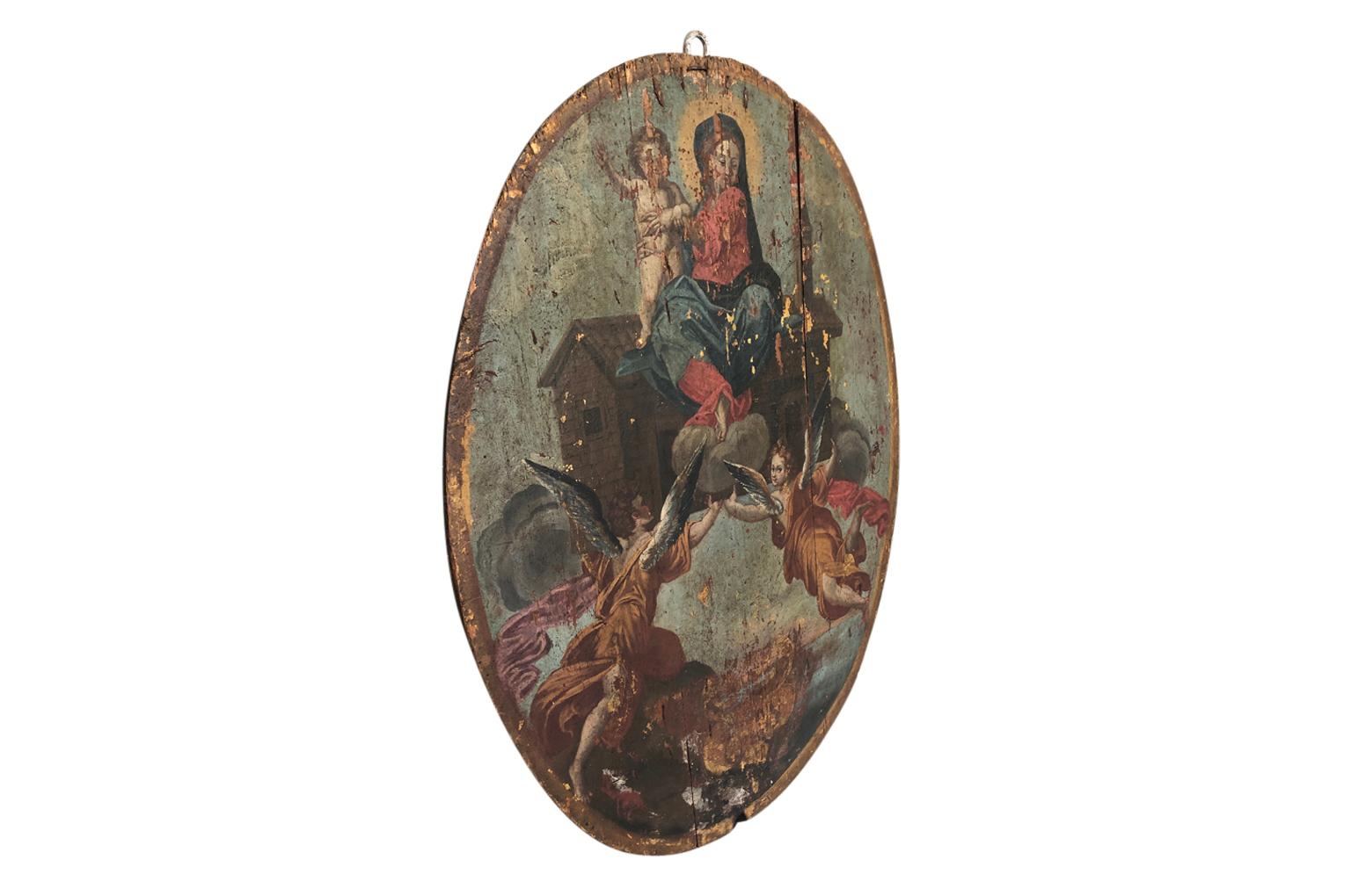 An outstanding and grand 17th century Baroque oil painting on an oval wooden panel of the Madonna and Child. Beautifully executed and stunning patina.