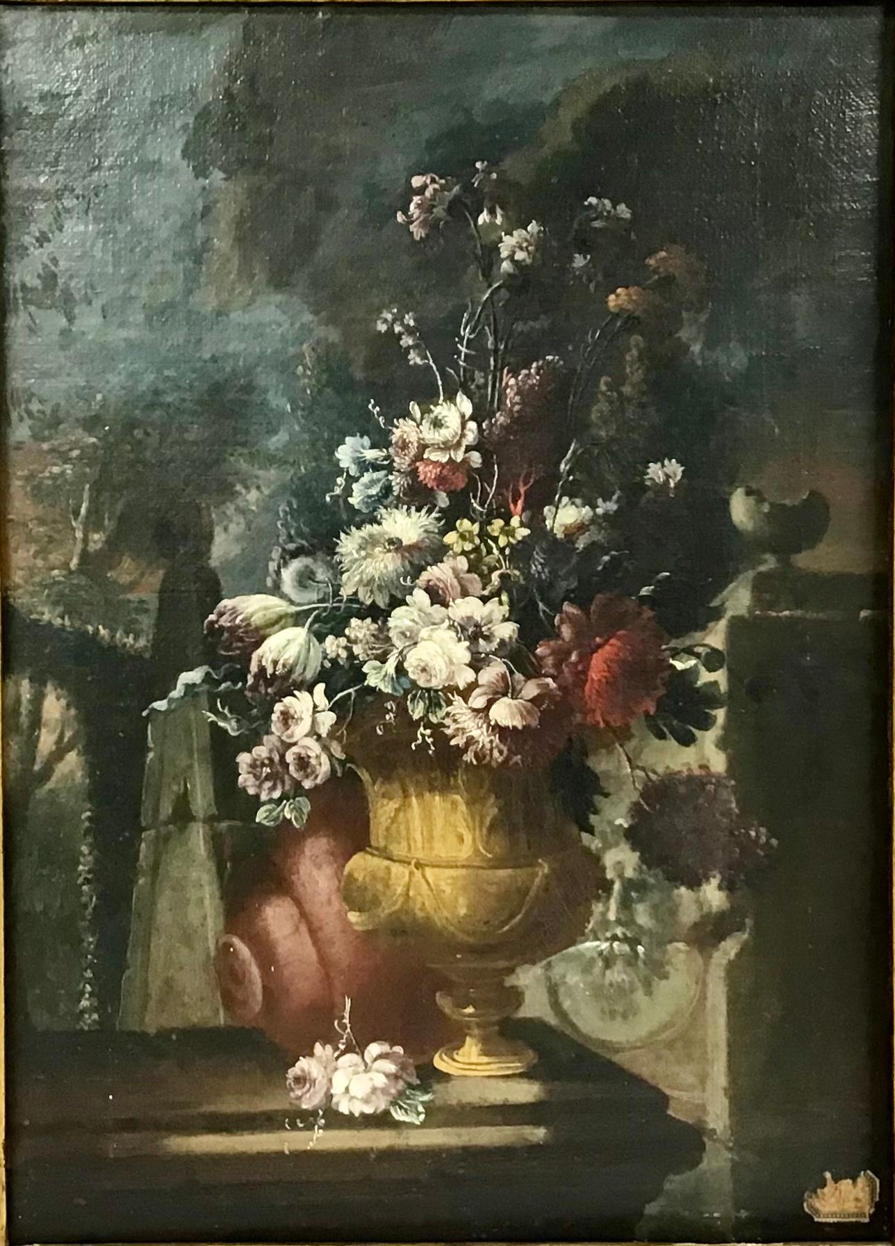 A beautiful Italian Still Life oil painting on old canvas of an urn holding a bouquet of assorted flowers set on a ledge. 17th century. The painting is in good antique condition. Some spots of in painting and paint loss, craquelure, and it has been