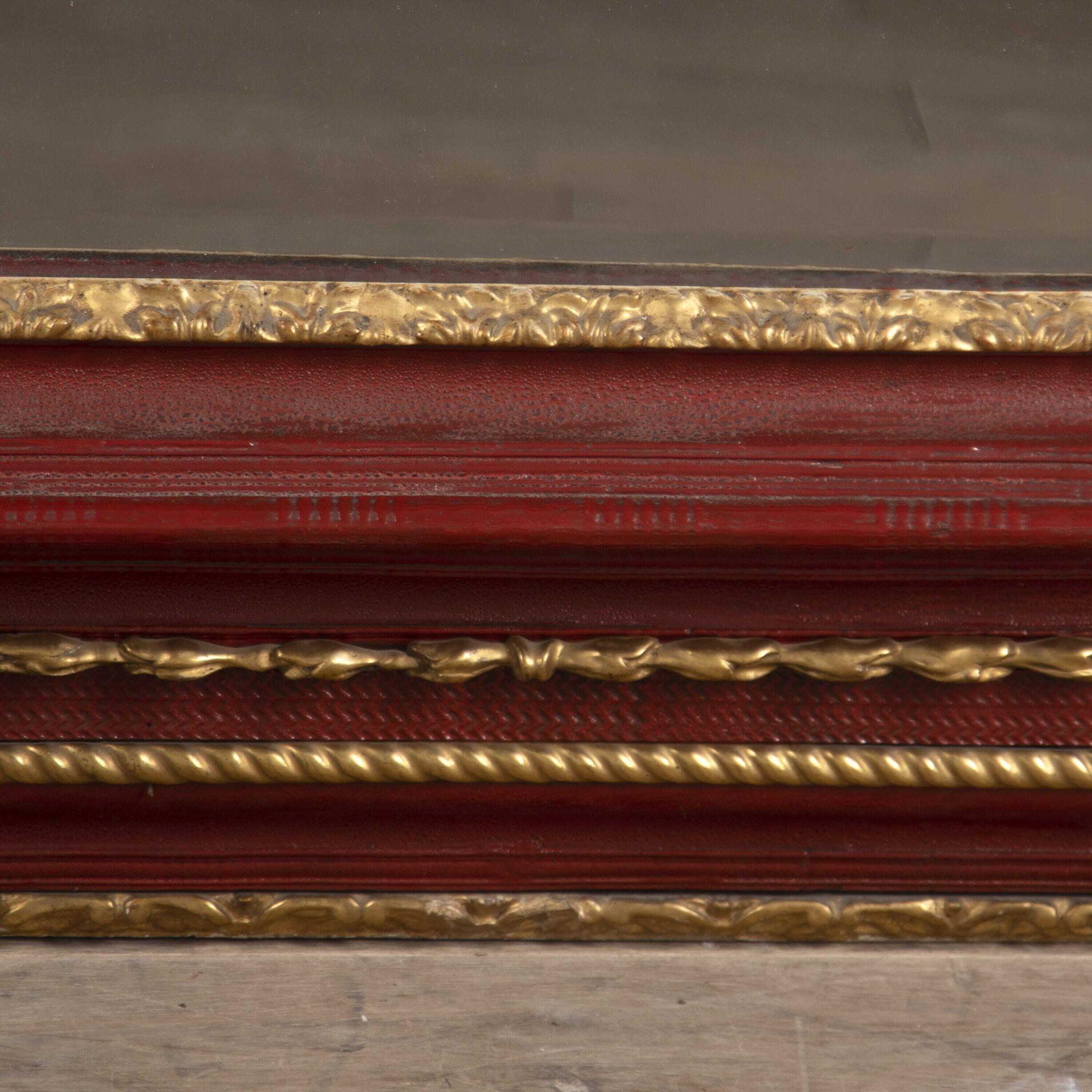 Late 17th century Venetian painted and giltwood mirror in a stunning cinnabar colour.
The various ripple and zigzag carving broken with carved giltwood mouldings surrounding a mercury plate with the shallowest of a hand-bevelled edge, all in