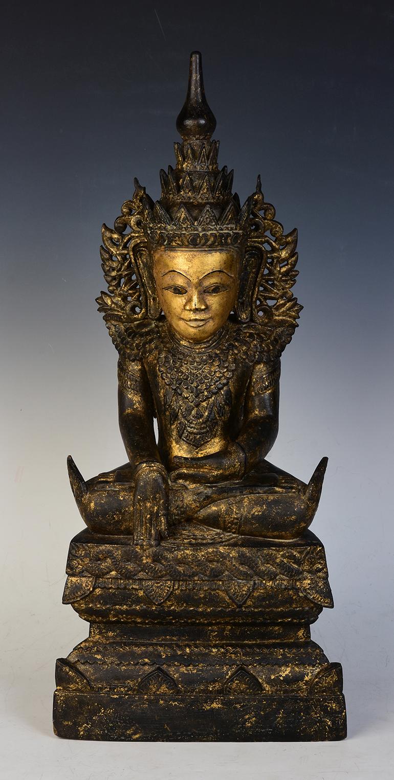Very rare Burmese wooden seated crowned Buddha or sometimes known as King Buddha, wearing diadem-crowns and ornaments of king instead of ordinary monk's robes, with gilded gold. 
This Buddha is special with an opening niche at the back of the base