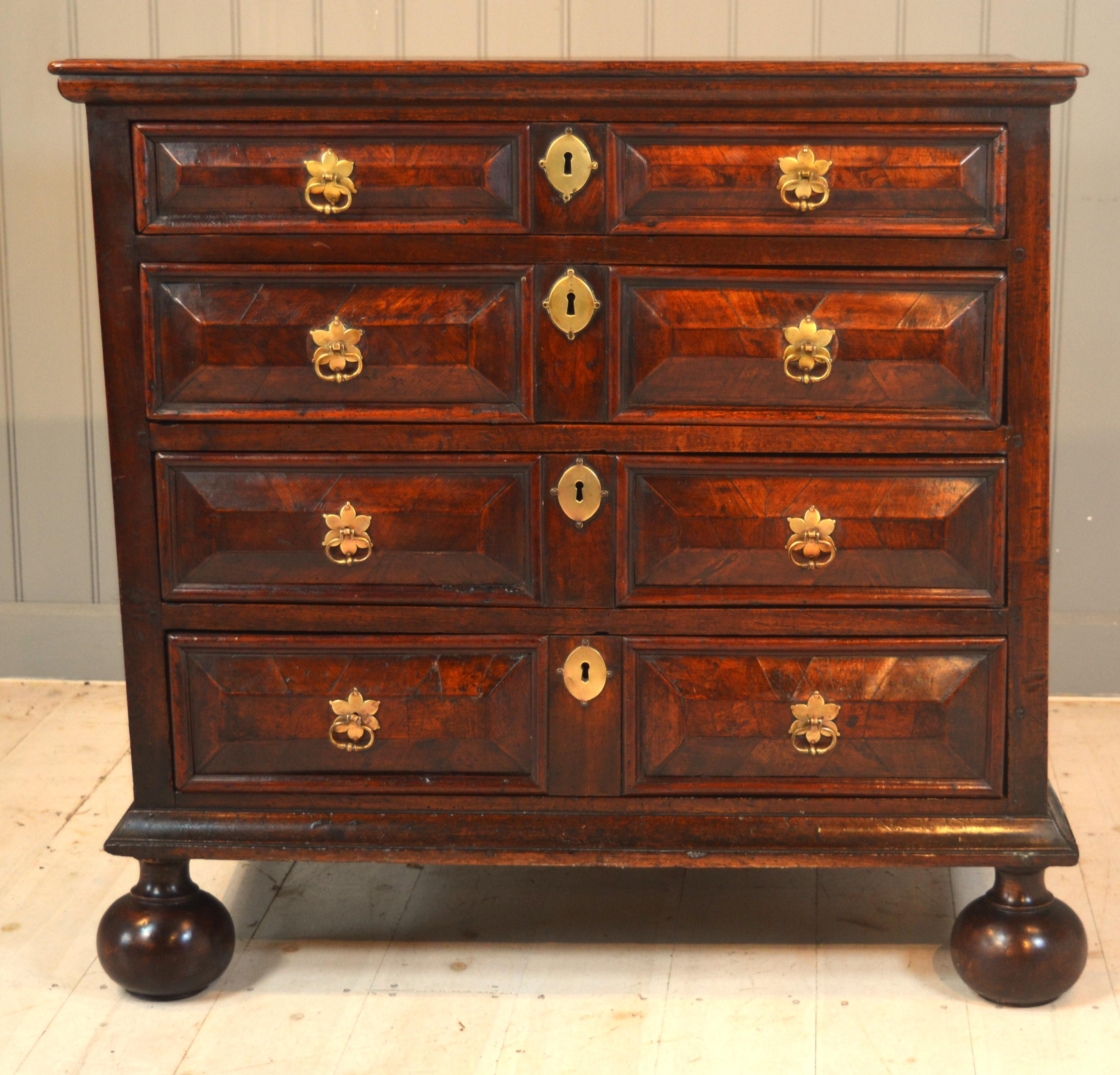 Here we have a very early piece of walnut furniture of small size in oak elm and walnut .The chest has elm sides, oak frame oak top and oak drawer linings . The drawers are on side runners as most early framed furniture is ,the front of the chest