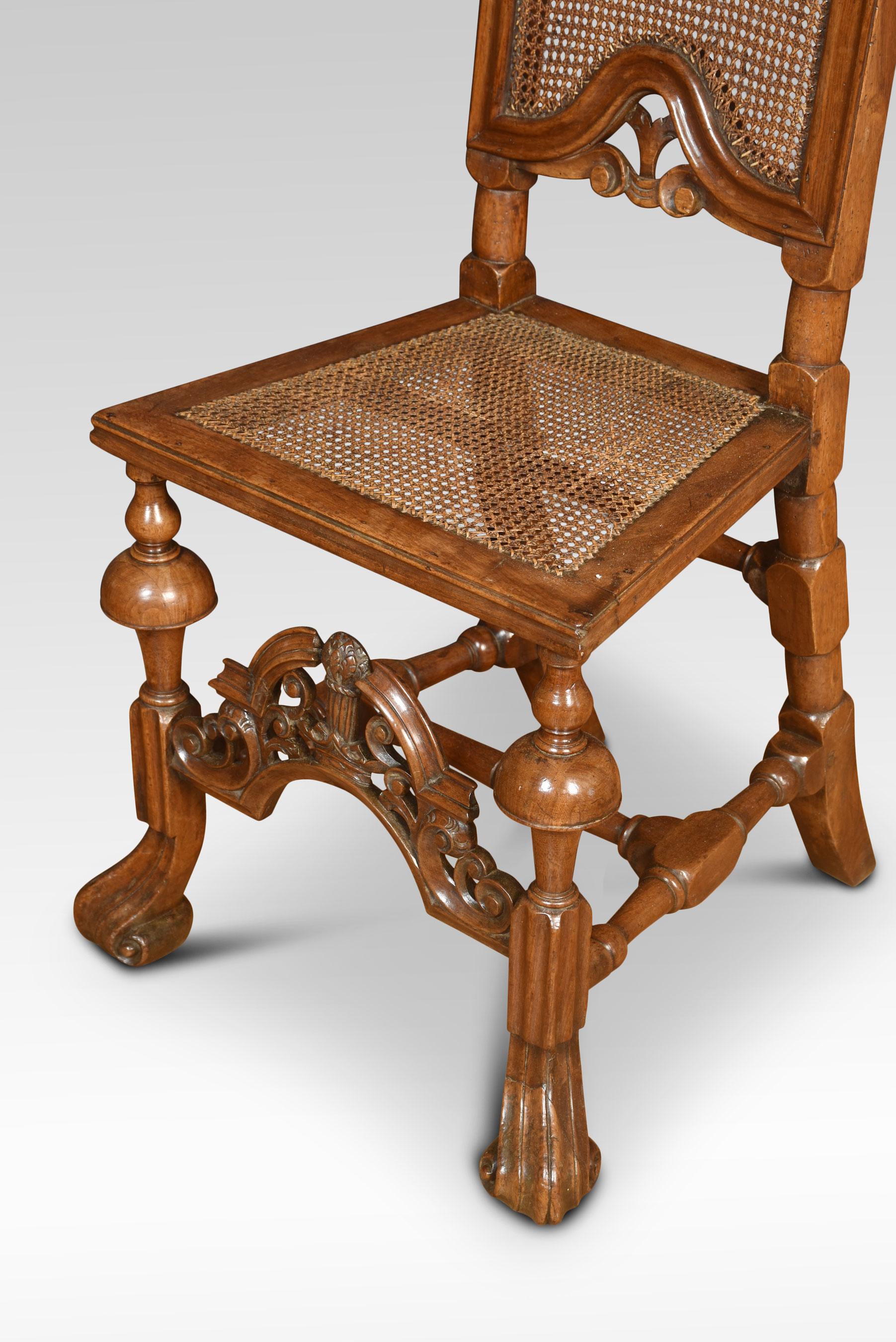 17th-century style walnut high back chair, with arched crest rail to the long cane, panelled back supported on scroll carved legs
Dimensions
Height 57.5 Inches height to seat 19 Inches
Width 21 Inches
Depth 21 Inches