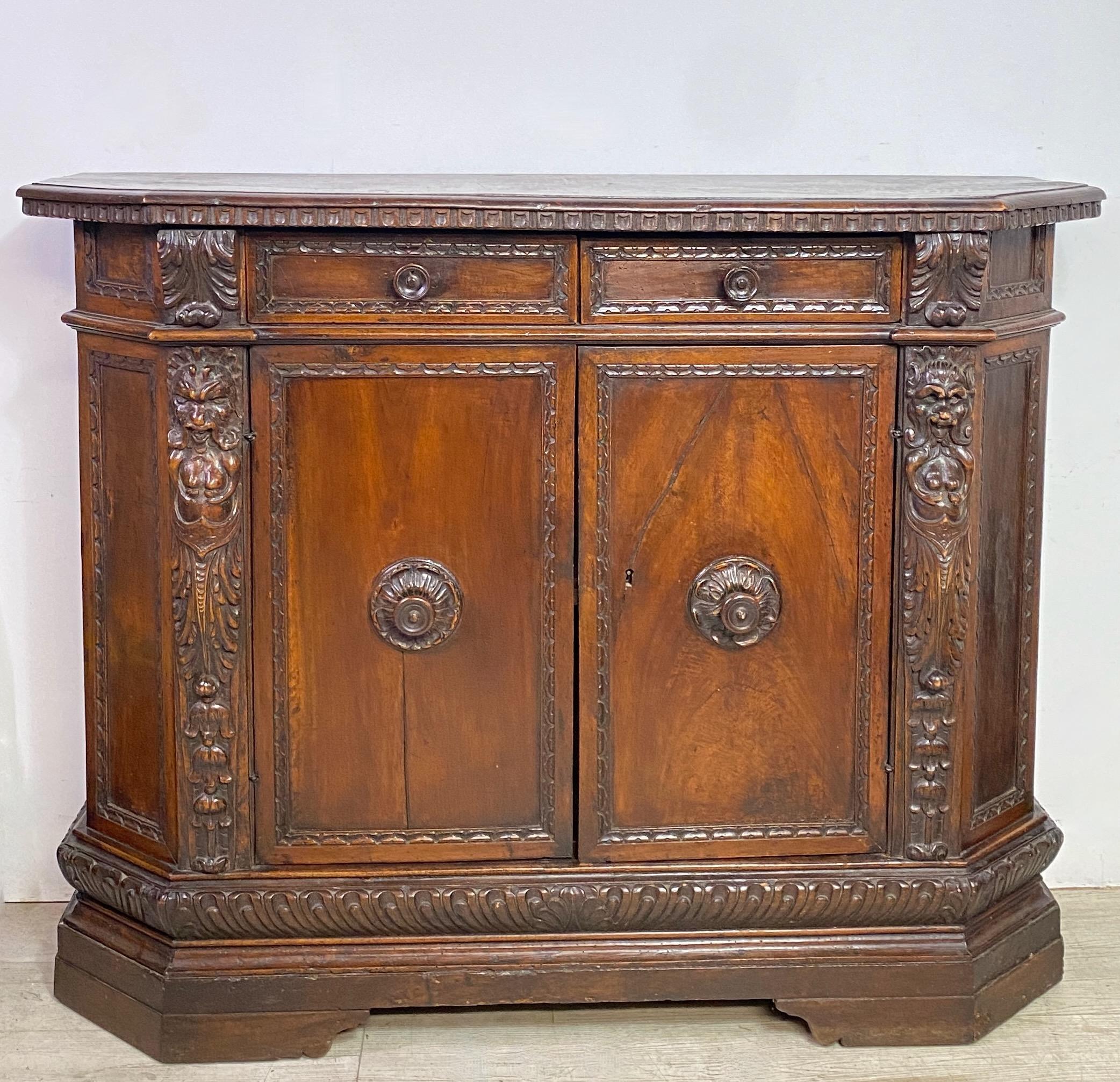 An extraordinary Tuscan Renaissance period walnut credenza in superb original condition.
Hand carved, warm rich original patina, having two drawers and a single interior shelf.
Italy, 17th century.