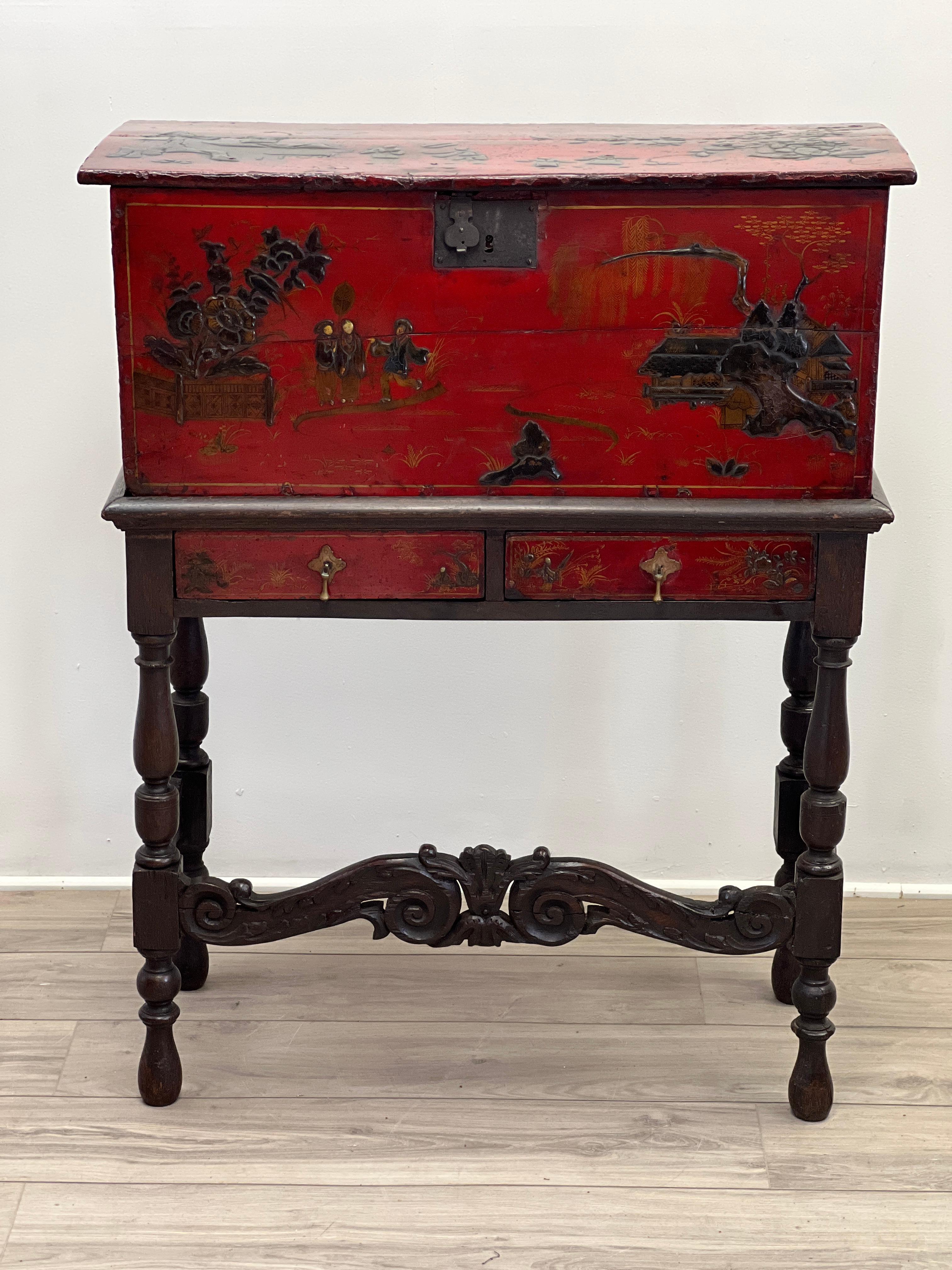 Featured is an extremely rare 17th century Dutch William & Mary Chinoiserie style coffer trunk on stand. This gorgeous piece was constructed of oak in the traditional William and Mary style. The trunk is japanned with red lacquer and was hand