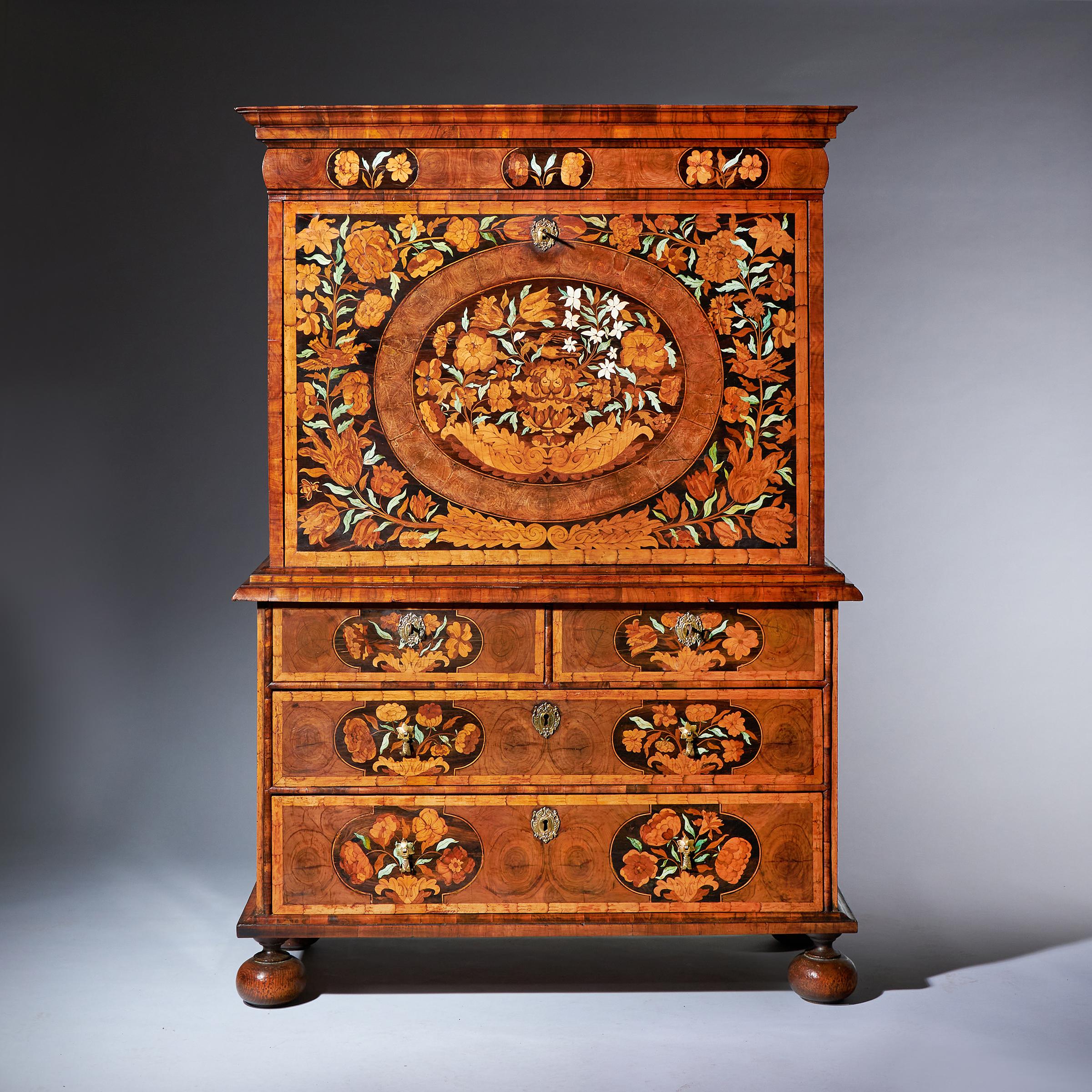 A remarkable and extremly rare William and Mary olive oyster and floral marquetry escritoire, concealing eight secret drawers, circa 1680. England. 

Attributed to Thomas Pistor. 

The cross-grain cavetto cornice sits over a cushion-moulded