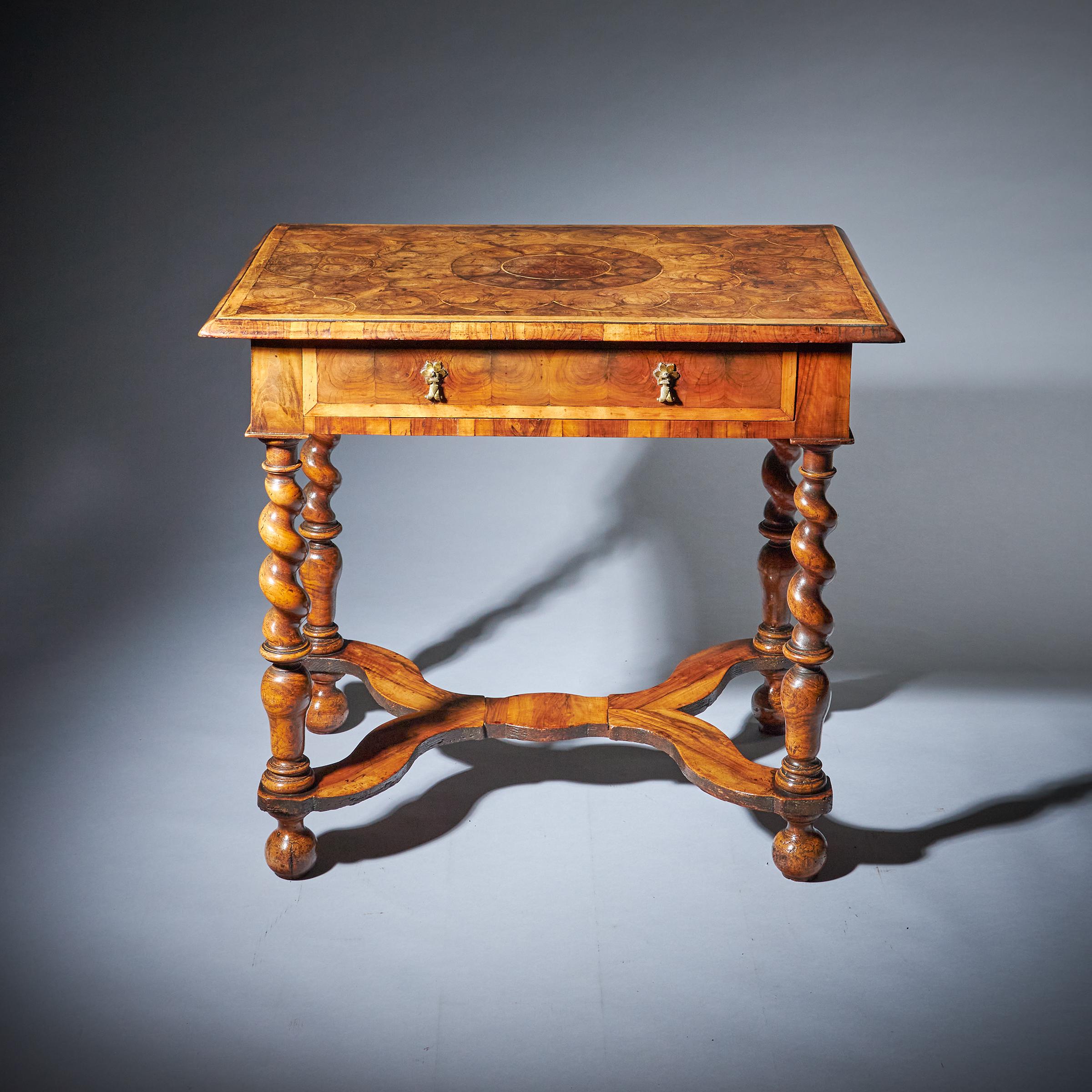 A rare and original 17th century William and Mary olive oyster table, Circa 1680-1700. England 

The ovolo-moulded top is banded in holly and entirely veneered in individually cut oysters of olive laid with thought and precision to create
