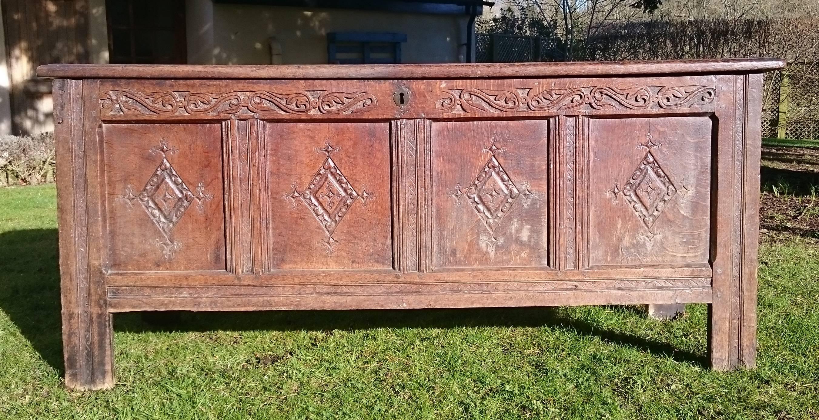 17th century antique oak coffer dating from the William and Mary period. This coffer has good moulded detail on the front of the legs, the uprights and around the panels on the top. There are four panels on the front and three on the top, the front