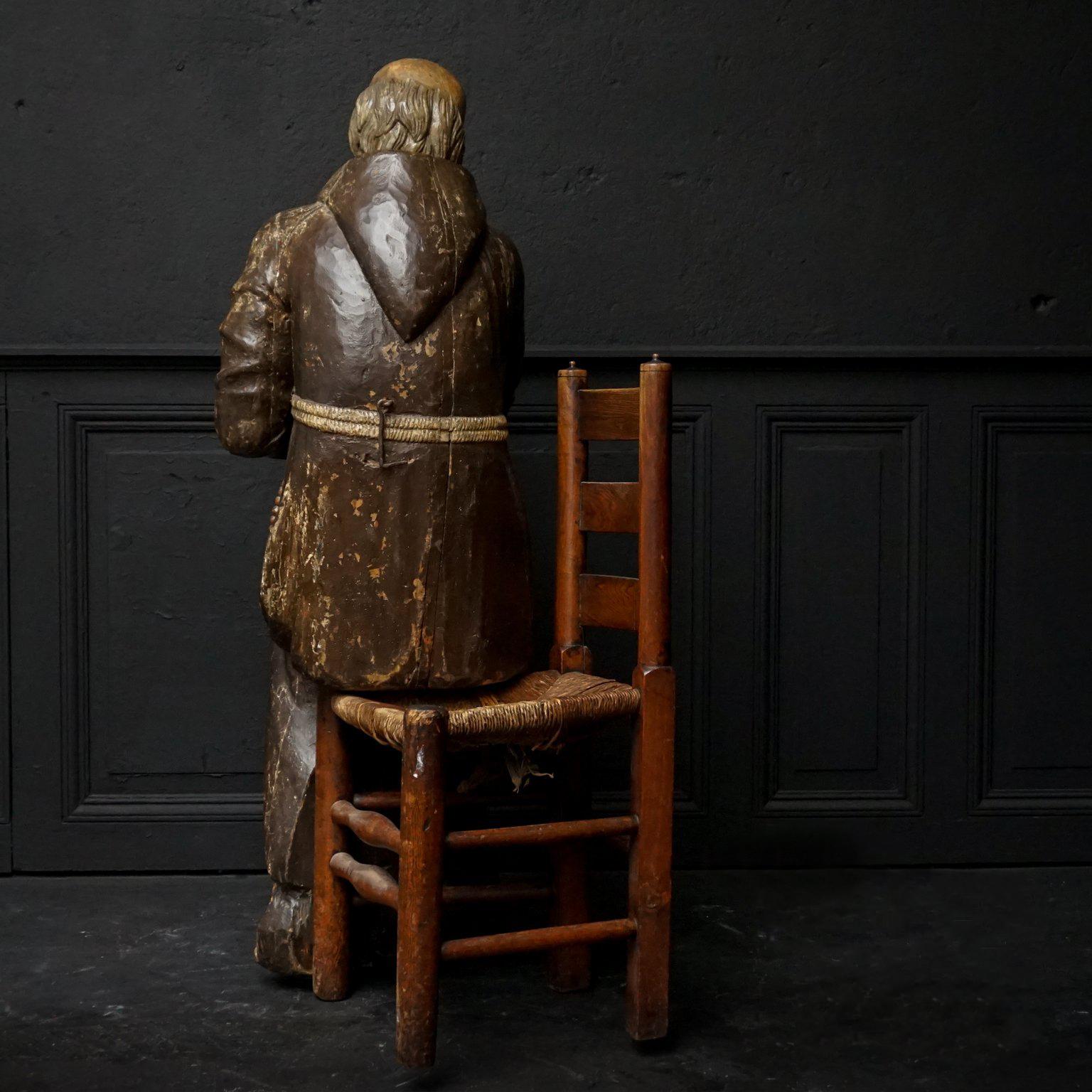 17th Century Wood Carved Polychromed Lifesize Sitting Franciscan Friar In Good Condition In Haarlem, NL