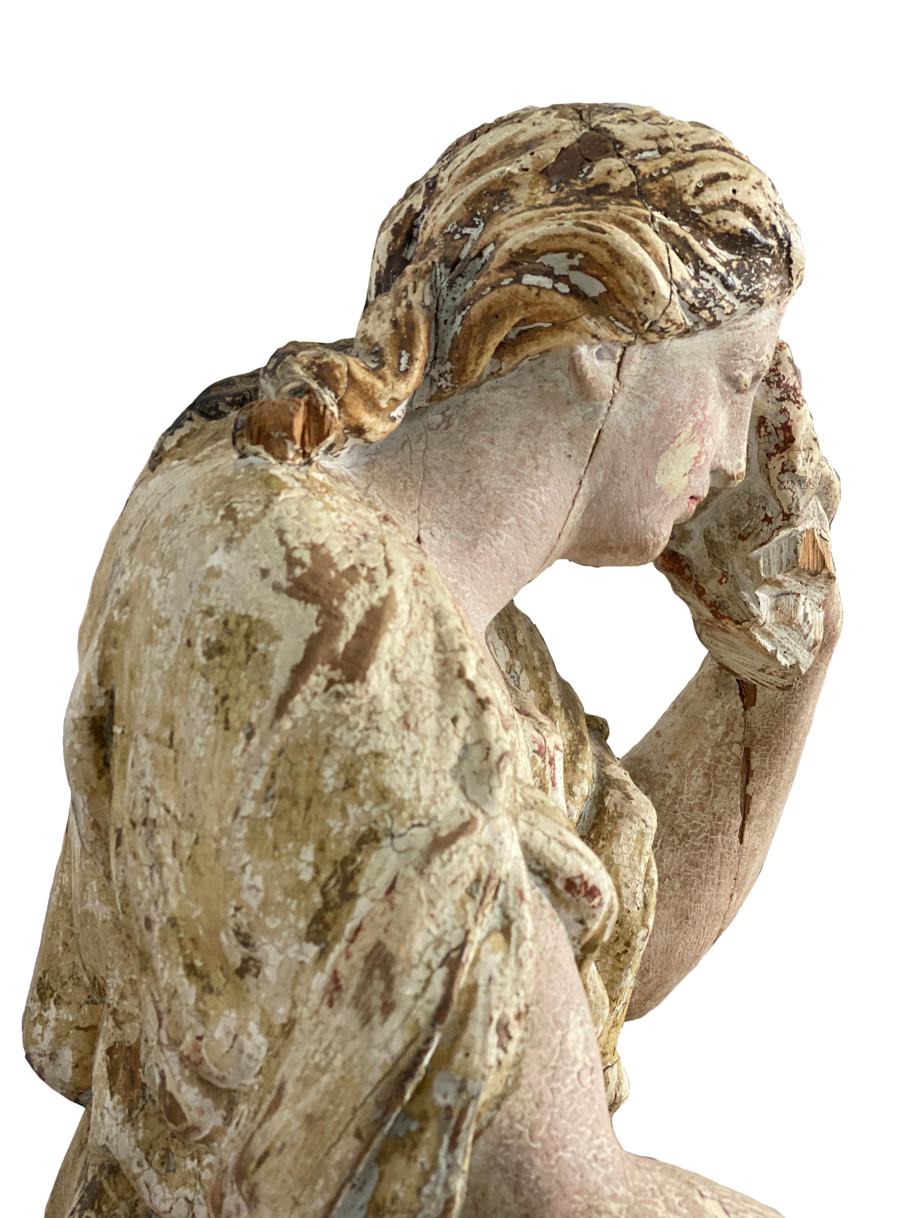 wooden statue of mary magdalene
