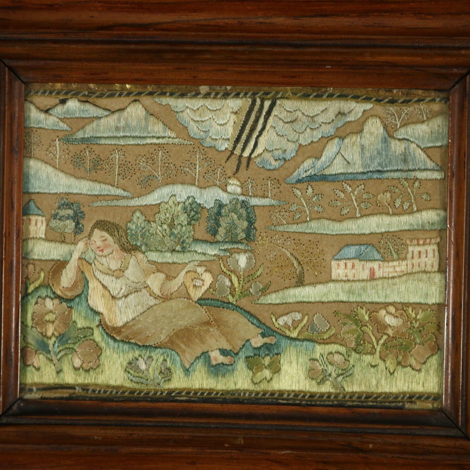 Late 17th Century, Miniature Silkwork Embroidery Reversable Picture. The embroidery is extremely finely worked in coloured silk threads on a paper or felt ground. Colours blues, greens, creams and browns. Pictorial scene depicts a lady, recumbent on