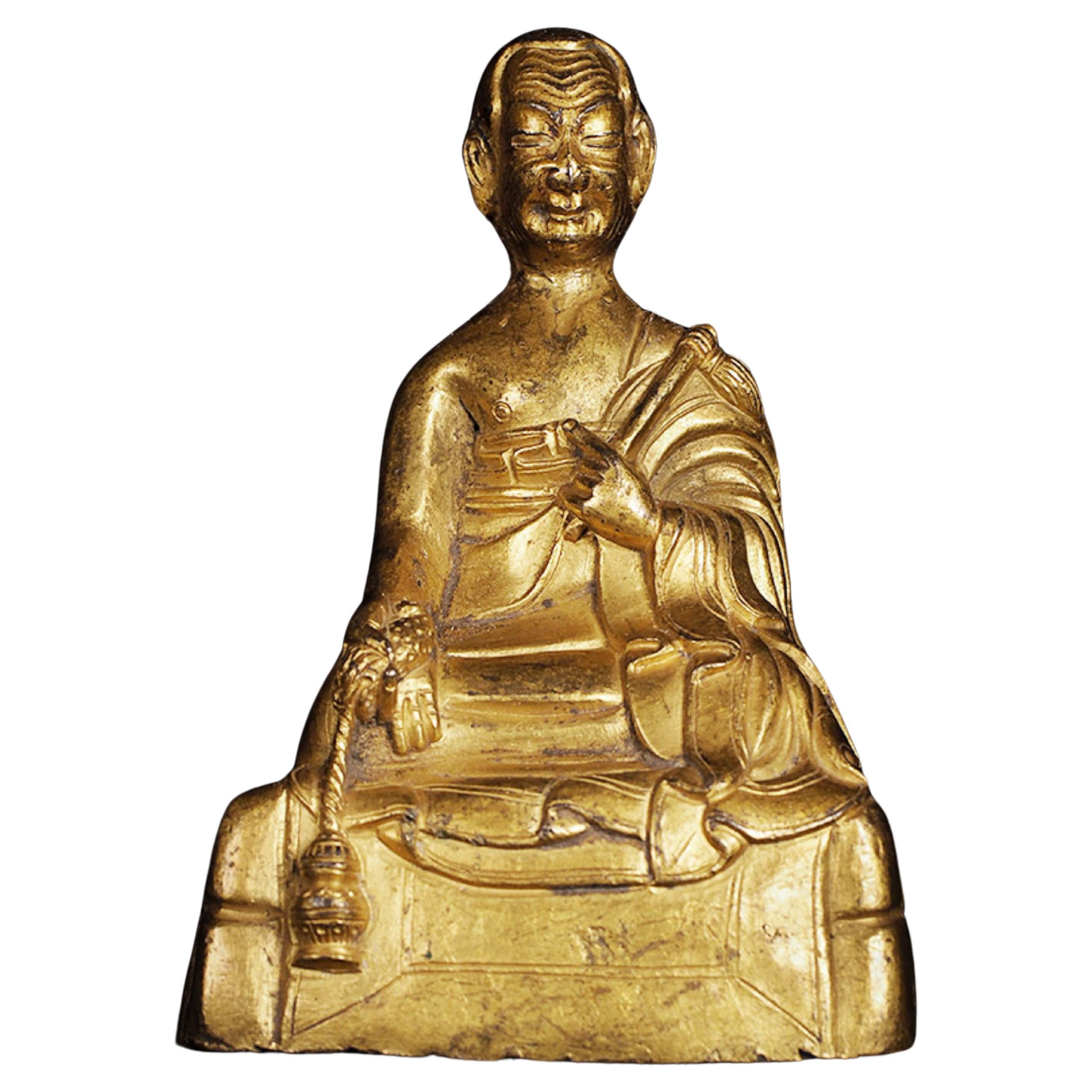 17thC or earlier Tibetan Buddhist Portrait Statue of a Monk in copper.-Animated For Sale
