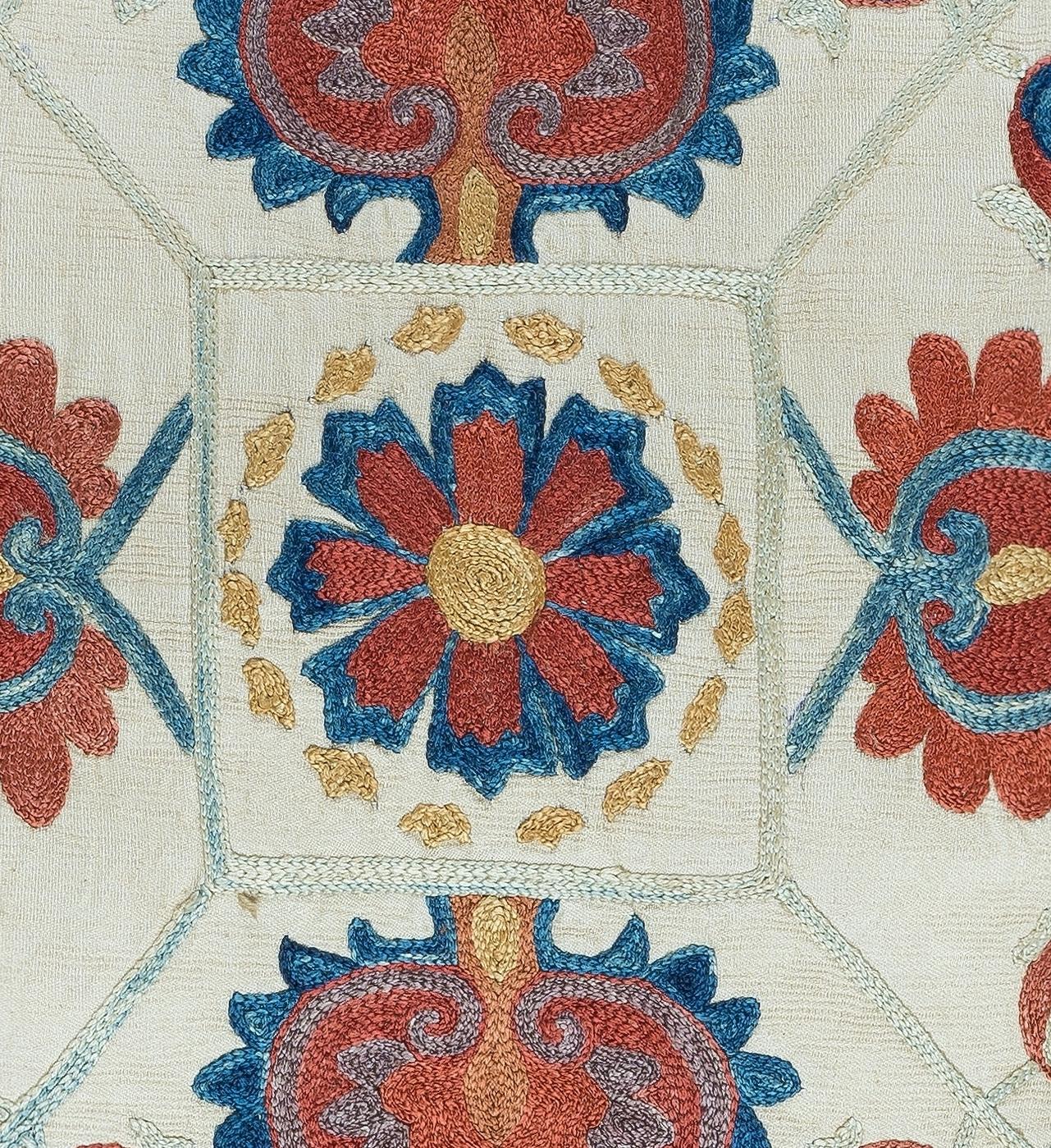 Decorative suzani cushion cover made of hand embroidery silk on silk background, flowers and vine motifs, linen backing with zipper, no insert.

Delicate and specialised washing advised. Measures: 17