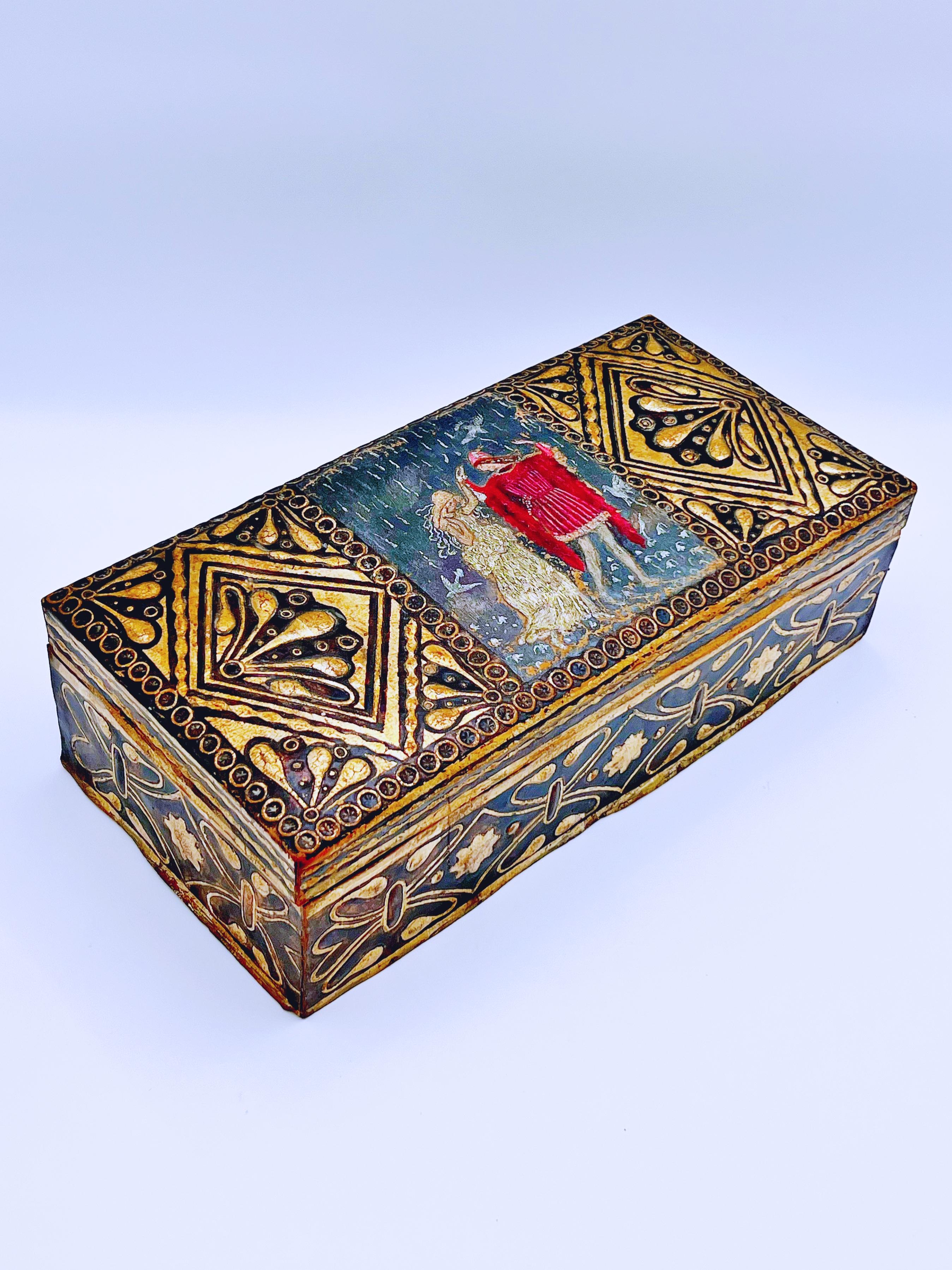 Antique wooden letter/keepsake box from ca. the 1920s, covered in 1800s’ cordovan / gold leather with a natural patina. The leather features decorated and hand-painted detailing, including a 