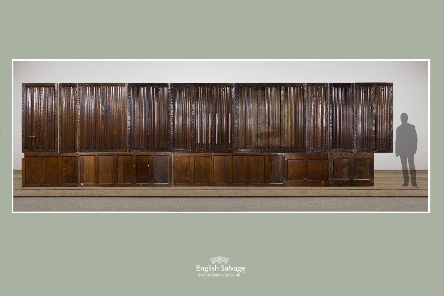 Reclaimed 18th-19th century oak panelling, with 9 hand carved linen fold and foliate bordered panels above six plain pegged panels, all totaling approximate 800cm wide x 227cm high. The linen fold panels are all roughly 151.5cm high x 4.8cm deep