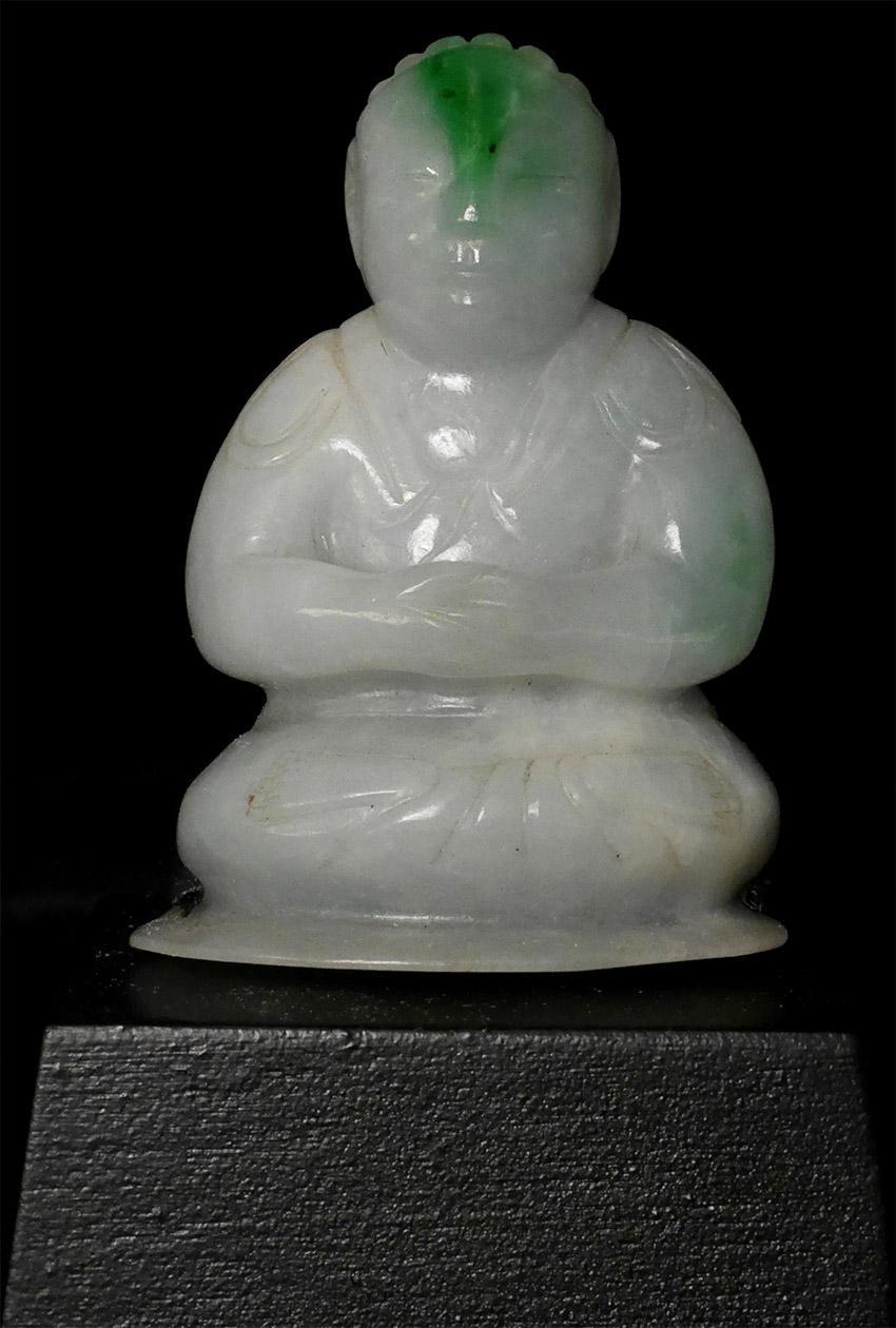 This is a very special 18/19 century Jadite Buddha. Purchased from a wealthy estate in Atherton California in the early 1980s this was the first expensive Buddha I purchased - almost 40 years ago. I was struck by the way the almost apple-green bolt