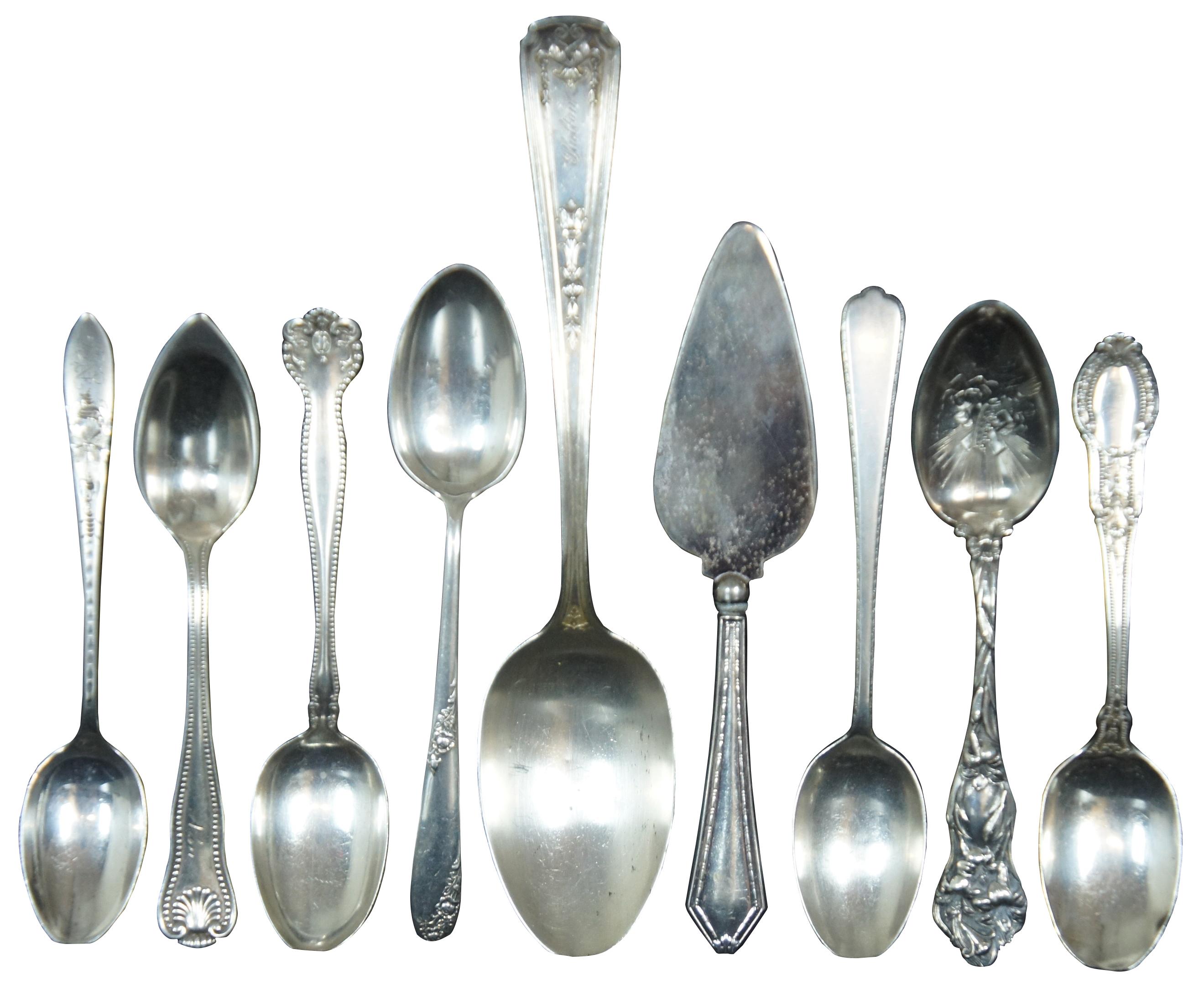 Lot of eighteen assorted antique / vintage sterling silver .925 tea, demitasse serving and souvenir spoons, plus one cheese spreader, manufactured by a variety of companies including Gorham, Robert Wallace & Sons, George W. Shiebler, Lunt, Saart