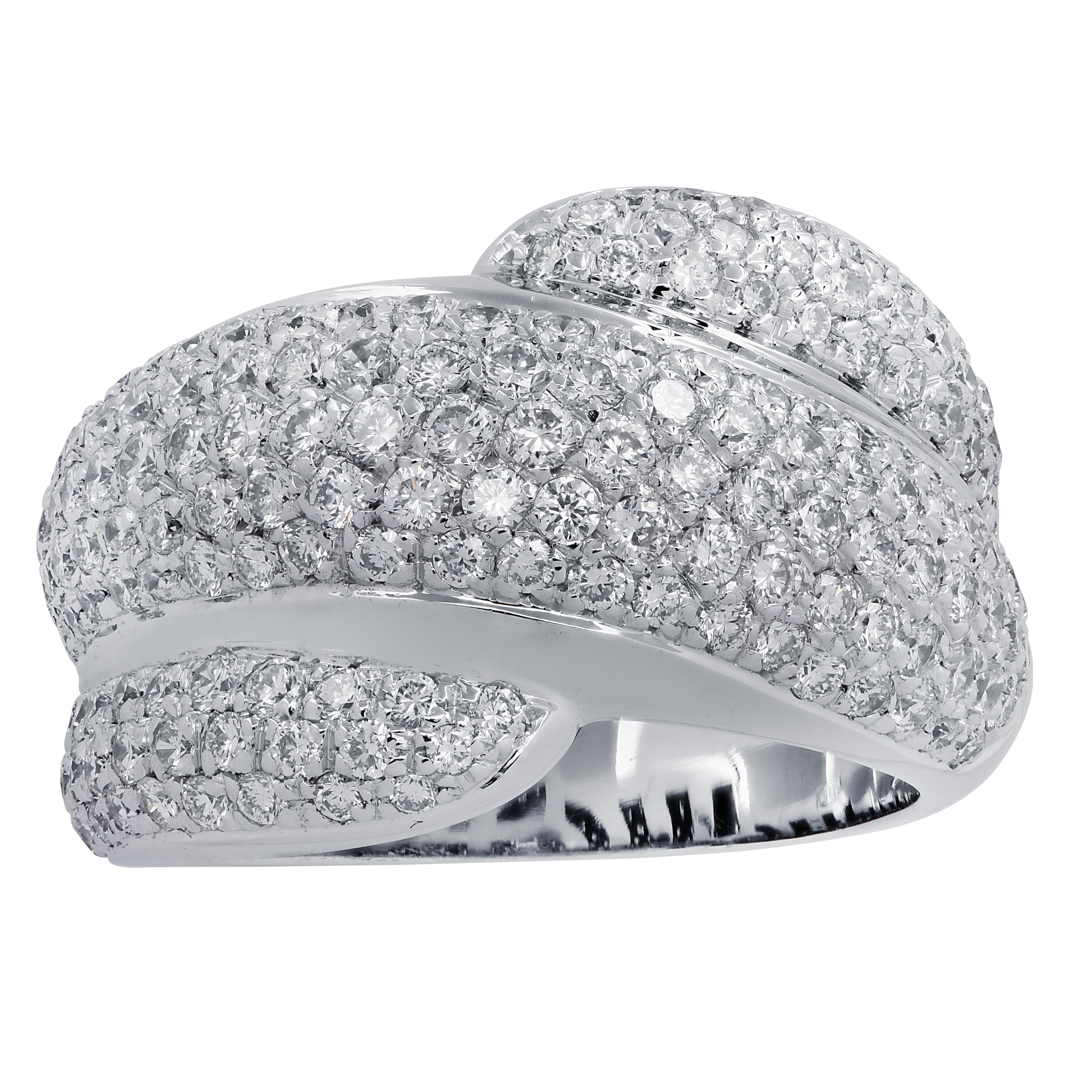 Striking band crafted in 18 karat white gold, featuring 3 rows, pave set with approximately 1.80 carats of round brilliant cut diamonds G color VS clarity. The diamond encrusted band wraps around the finger in a dazzling display of fire and light.