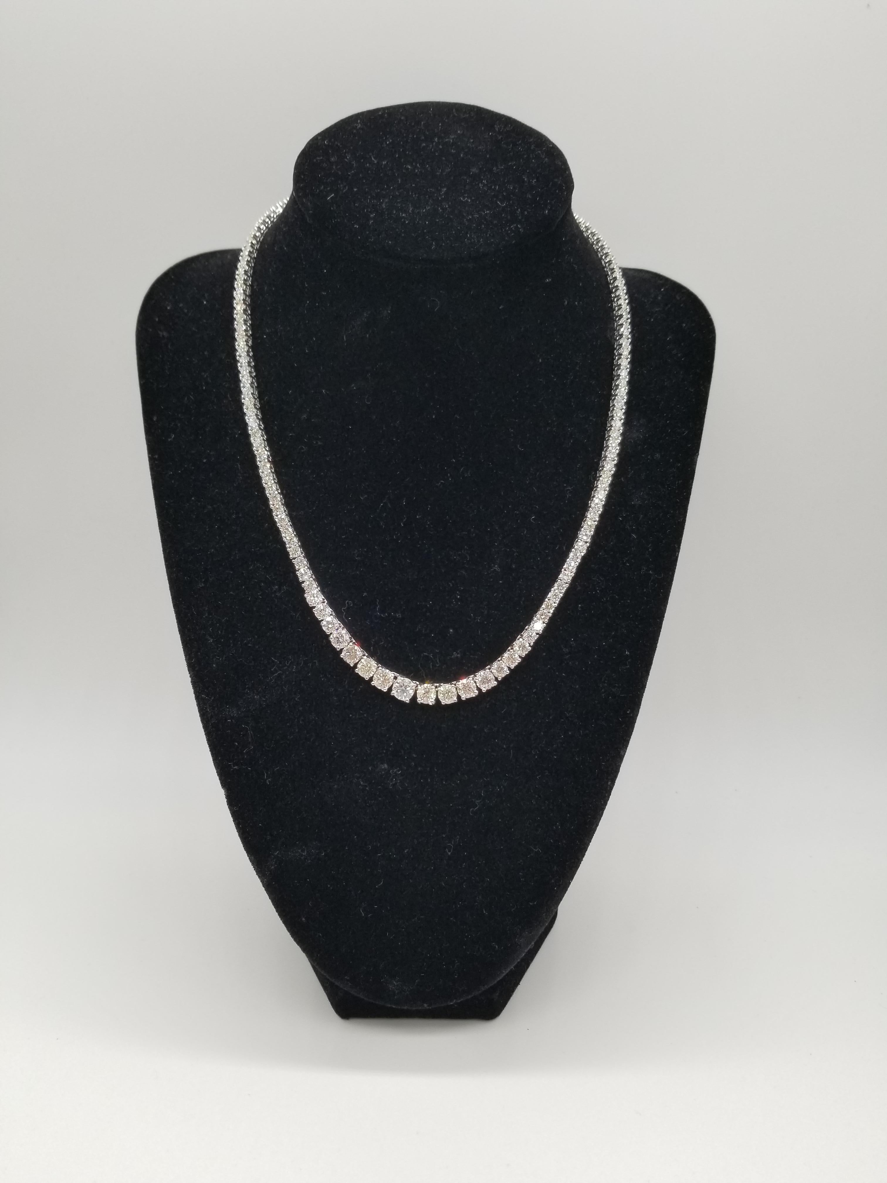 Stunning 14 Karat White Gold Round Brilliant Cut Diamond Riviera Graduated Tennis Necklace set on 4 prong setting. The total diamond weight is 18.03 carats. 131 pcs natural diamond size from 0.70 pts to 10 pts. The closure is an insert clasp with