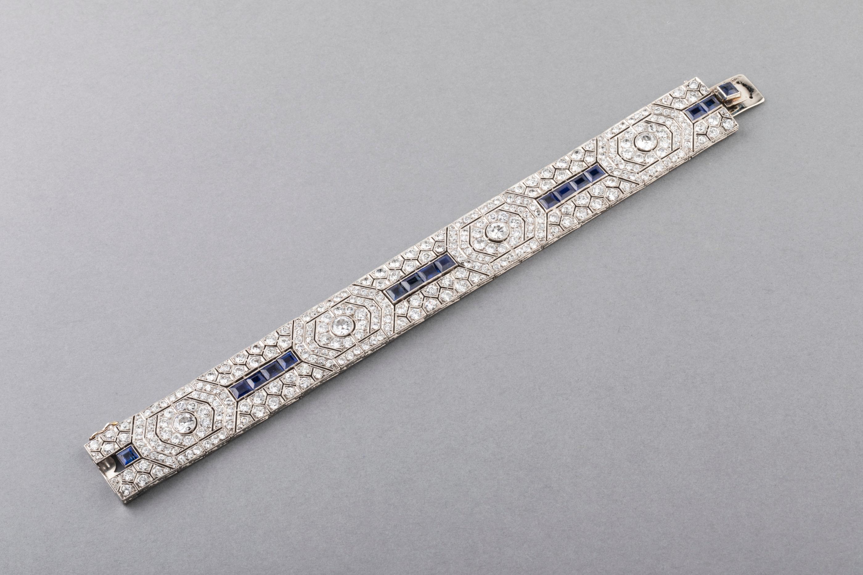 18 Carat Diamonds and 5 Carat Sapphires French Art Deco Bracelet

This is a very beautiful piece. The workmanship is quality.
 Made on France circa 1920, early art deco era. The diamonds are very white in color and the sparkle is impressive. 
The