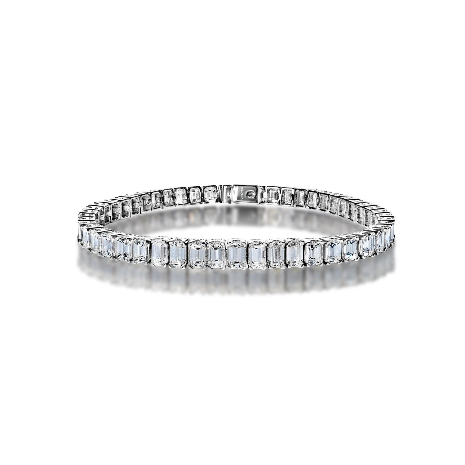 Beautify yourself with this exquisite Emerald Cut Diamond Tennis Bracelet in 18K White Gold. A line of 17.92 carats packed with  sparkling and fiery emerald cut diamonds set in the 4 prong 18K white gold setting, with a box catch and hidden safety.